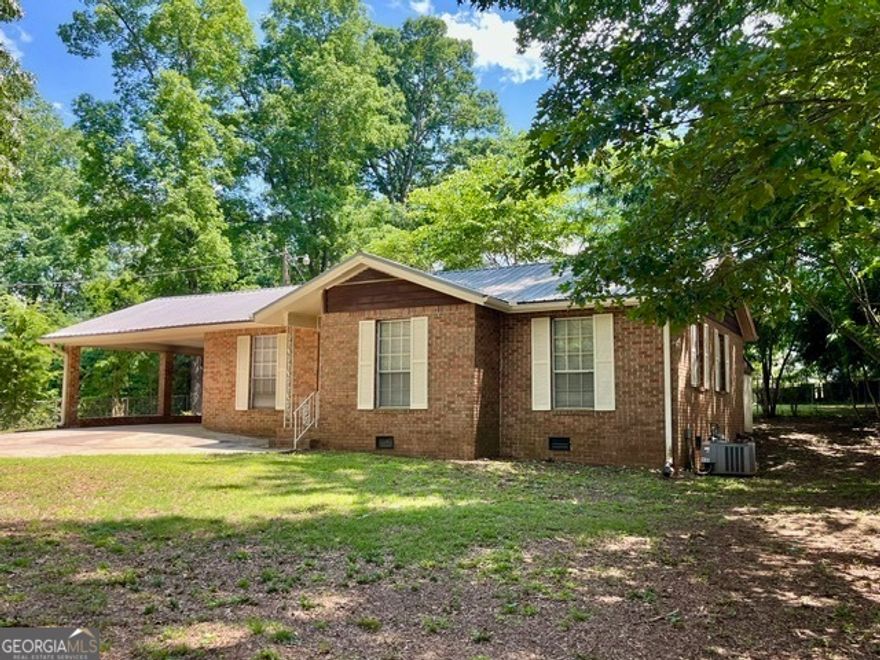 Back on Market Buyer Financing Fell Through!  Location Location Great Location minutes from I 75 Older Quiet Established NeighborHood  Secluded Back Yard 2 Bedroom 1 Bath Awesome Workshop and She Shed Large Fenced Yard with Gate Remolded new appliances New Flooring and Paint Metal Roof Minutes from I 75 did we mention the Location and awesome workshop!