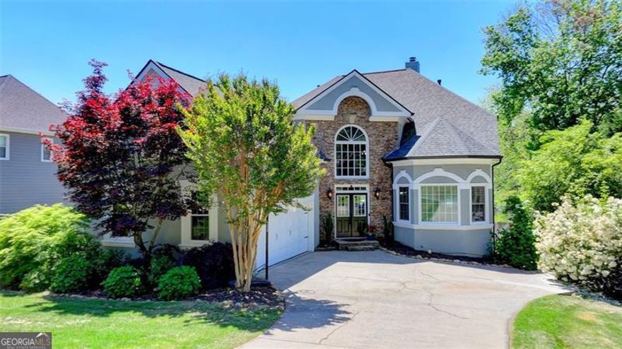 SPECTACULAR LAKE HOME WITH LOADS OF UPGRADES INSIDE & OUT! 5 BD + Bonus/4.5 BA with Owner's Suite on Main & Finished Basement. This rare waterfront retreat features a personal dock, spacious backyard, and stunning lake views from multiple rooms. Generous updates include a fully remodeled kitchen, 4.5 updated bathrooms, and a recently replaced roof, and water heater. The walk-out basement offers over 1800 sq ft of fully finished space, including a guest suite, bathroom, kitchenette, media room, and office. Enjoy fishing, canoeing, and paddle boating on the lake, along with access to community amenities like heated pools, tennis and pickleball courts, a gated playground and social events. An incredible home in a vibrant community!