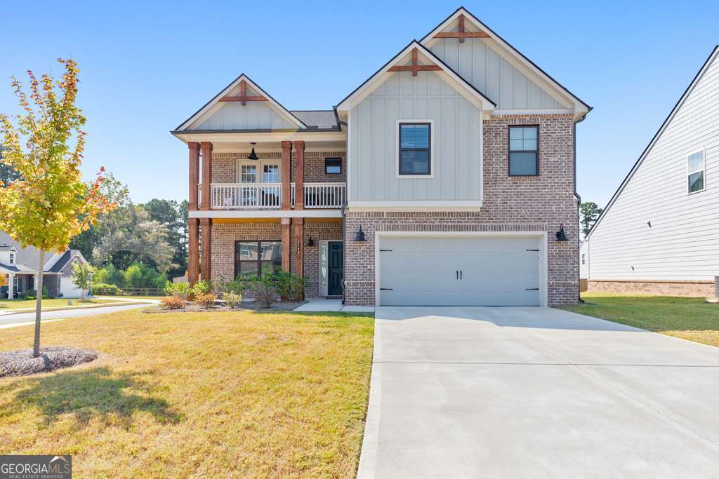 Built in 2023, this stunning 4 bedroom, 2.5 bathroom home offers modern design and thoughtful details throughout. Perfectly situated on a desirable corner lot, a charming covered front porch welcomes you into a bright foyer that flows to the separate dining room. The chef's kitchen boasts stone countertops, a center island with seating, a sunny breakfast area, a pantry, and sleek finishes, and it opens directly to the fireside family room-ideal for relaxed entertaining. Upstairs, the spacious primary suite features tray ceilings, a spa-like ensuite with double vanities, a soaking tub, a separate shower, and a large walk-in closet. Three generously sized secondary bedrooms share a full bath, and one includes a private covered front deck-perfect for morning coffee. Relax outdoors on the covered back patio overlooking the spacious fenced yard, or enjoy the convenience of the attached 2-car garage. Located in the desirable McEachern High School district, this home offers easy access to major roadways, Marietta Square, and abundant shopping and dining options. Move-in ready and perfectly located, this property is a must-see!