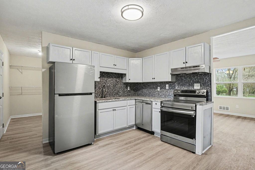 Photo of 8355 Dunellen Lane, Jonesboro, GA 30238 (MLS # 10701280)