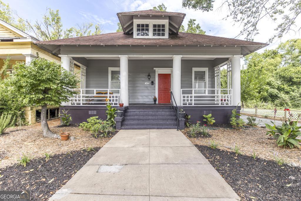 Completely Renovated 1920s Cottage - Cute as Can Be! This adorable 1920s cottage has been thoughtfully renovated while preserving all its original charm! From the decorative fireplaces throughout to the 10-foot ceilings and gorgeous pine hardwood floors, every corner radiates character. The open layout connects the cozy living room, dining area, and updated kitchen-perfect for entertaining or enjoying everyday life. With three bedrooms and two beautifully updated bathrooms, this home offers both comfort and functionality. Located in a fast-developing area just minutes from Mercer University and downtown Macon, this gem is the perfect blend of charm, convenience, and smart investment potential. Also available for rent at $1,375 per month!