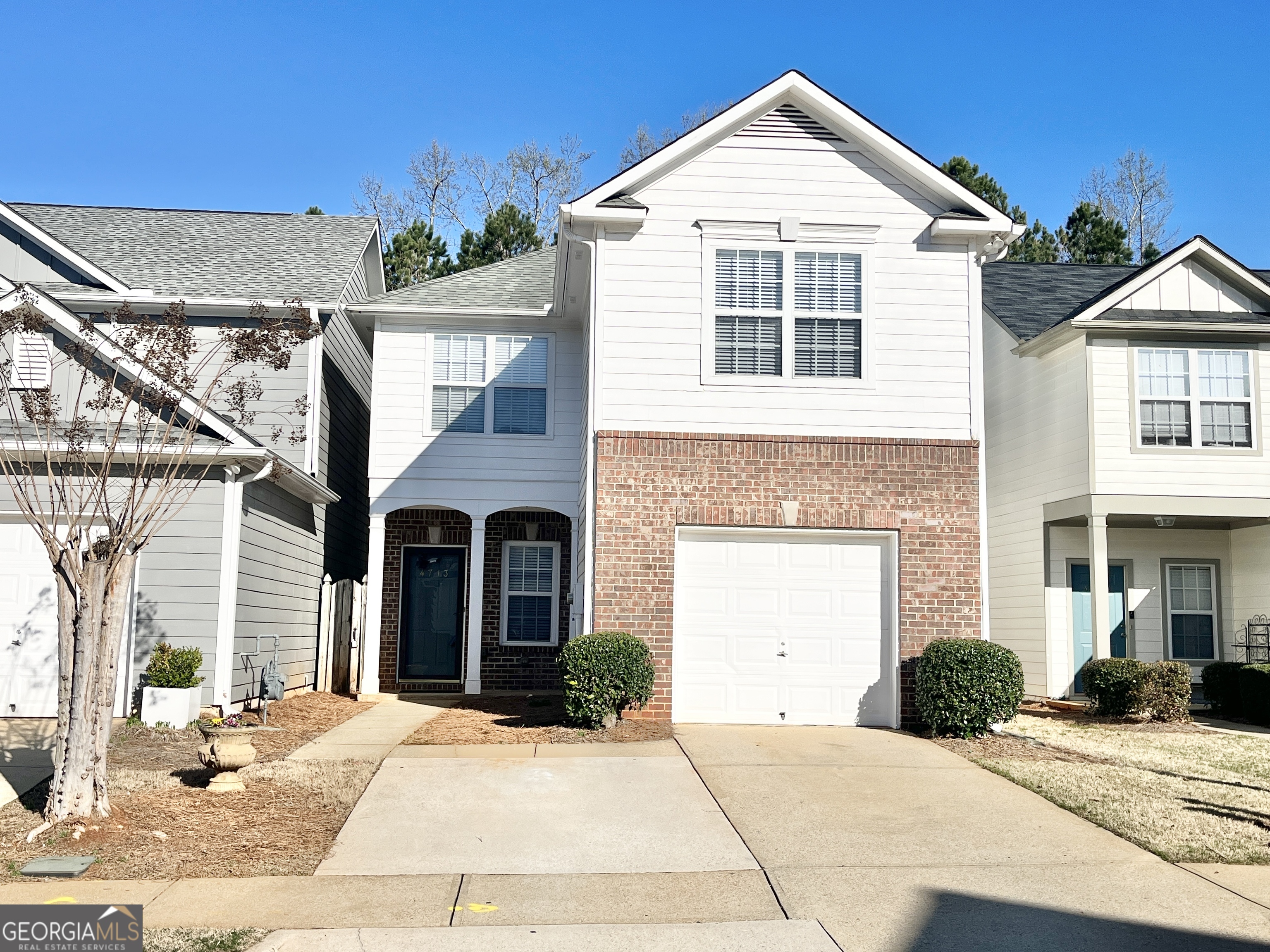 This beautifully updated 4-bedroom, 2.5-bathroom home is located in the desirable Copper Springs subdivision. With fresh paint and new carpeting throughout, this home offers a modern and inviting atmosphere. The spacious kitchen features stainless steel appliances, a pantry, and plenty of counter space, making it a cook's dream. The open dining area flows seamlessly into the living room, perfect for entertaining guests. The main level also includes a convenient laundry room, and the washer and dryer are included. The large primary bedroom is a true retreat, with an en-suite bathroom that boasts a dual vanity, a garden tub, and a separate shower. The expansive walk-in closet offers ample storage space. Enjoy the outdoors with lawn care included, making maintenance a breeze. This home is ideally located, with easy access to shopping, dining, and the University of North Georgia. Don't miss the chance to make this lovely home yours! Sorry No Pets.