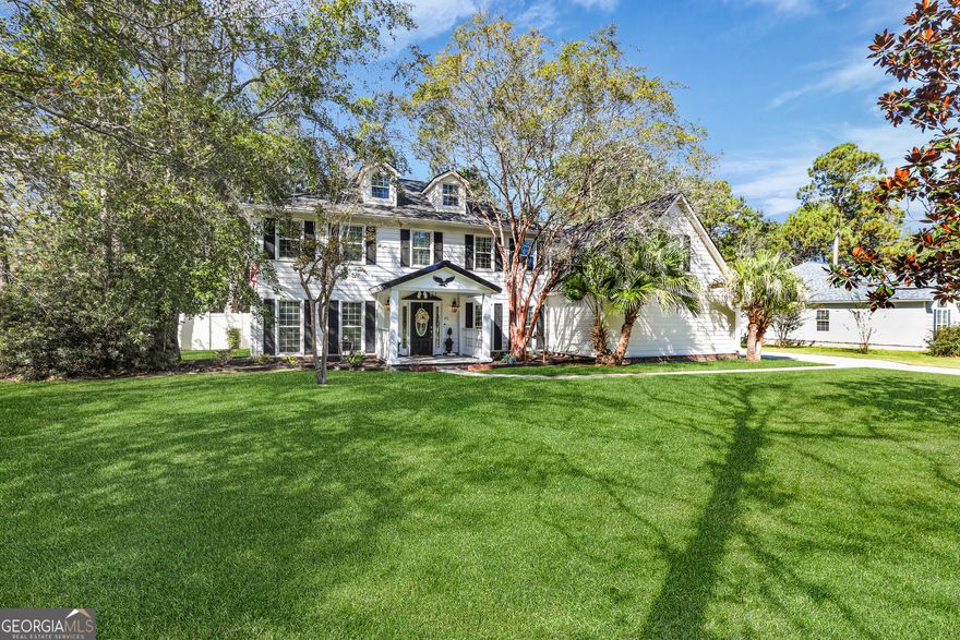 This charming residence is situated in one of Statesboro's most desired neighborhoods. The community pond is just a short walk away perfect for fishing, enjoying a picnic, or simply sitting back to take in the peaceful surroundings. Conveniently located close to the hospital, walking distance to GS, shopping, and all essential city amenities, this home offers both comfort and convenience.  This impressive two-story remodeled home features four bedrooms, three bathrooms, and spans 3,298 square feet. It has been tastefully updated, showcasing a stunning kitchen with granite countertops, stainless steel appliances, a pantry, and modern light fixtures. The dining room and breakfast room offer plenty of space for gatherings and entertaining while two living rooms provide flexibility-one overlooking the beautiful backyard! Upstairs, you'll find three bedrooms, two bathrooms, and a versatile bonus room with an adjoining space ideal for heated and cooled storage or as an additional flex room.   The renovated bathrooms and updated light fixtures complete all the details.   Step outside to your own private oasis. The backyard is a true retreat, featuring a sparkling in-ground pool, fenced yard, and plenty of space to entertain. A covered porch with a gorgeous tongue & groove ceiling, a designated area perfect for an outdoor kitchen, and even a tiki hut makes this backyard one-of-a-kind-ideal for relaxing or hosting unforgettable gatherings. You have plenty of parking with the 2-car garage and custom-built double carport all tucked away on a peaceful cul-de-sac, it's a setting you'll never want to leave. The backyard greenhouse is a perfect space for growing herbs, flowers and fresh produce year-round.    Contact us today to schedule a viewing.  Properties like this don't stay on the market for long!  *seller is offering a 2 year home warranty.