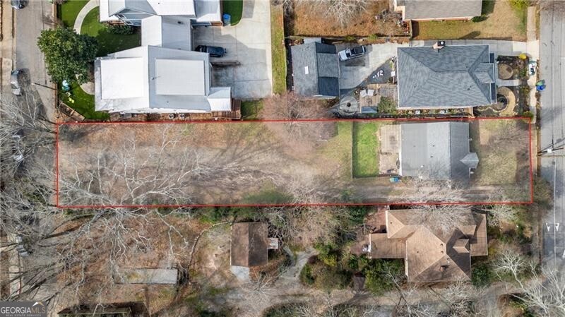 BRING YOUR BUILDERS! Approved plans by the city to build 3981 sq ft including 5BR/4.5Baths, upstairs loft, rec room, wet bar, exercise room and 2-car garage. Plans require expanding the house on adjoining lot 681 Home Ave SE to build duplex style house to attach to new home on Robinson Ave. Plans expand existing home to 2250 sq ft adding a large family room and true primary suite. As you will see in photos the existing house has already received an update kitchen & baths as well as featuring hardwood flooring, recessed lights and crown molding. The current living room/dining room would become a large dining area. Side sun room is currently being used as a mud room. Kitchen features gas cooking and white shaker cabinets. Walk-in laundry room. Aside from builders this is an excellent opportunity for a buyer to live in the existing house while building the new home to their specifications and then selling the existing home for profit or retaining it as an investment property. All plans available to share, all that's left to do is apply for the building permit! Both sides of the lot already have separate TAX ID numbers. Lot is only approved to builder if you first expand house on adjoining lot - total sales price $675k. You may purchase lot separately, but would not be able to build on it unless owner of the house expands to property line with approved plans first.