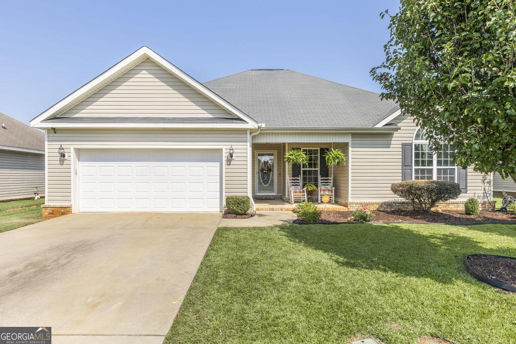 STUNNING new listing! Now presenting this well-kept 3 bedroom, 2 bathroom home that is overflowing with modern charm and beauty. Located in the highly-desirable Avington Glenn subdivision, this move-in ready residence features NEW flooring throughout the living and common areas, as well as the master bedroom. The spacious master suite is well-appointed with a soaking tub, double vanity and his/her's closets to provide comfort and ease. Being a split floorplan, the layout is ideal for families to provide privacy for everyone to reside peacefully. At the centerpoint of the home lies a comfortable and cozy living area, perfect for family movie nights, friendly gatherings or relaxing after a long day. As the open layout flows along, you will enter into the kitchen which features granite countertops, stainless-steel appliances and ample cabinet storage. The two additional bedrooms consist of adequate space for a growing family, or make great space for a home office or craft room. On the exterior, you will find appealing features such as a covered back patio, privacy fence and 360 degrees of a NEW sprinkler system that allows your landscaping to remain perfect throughout every season. Being located just minutes from local schools, the eateries and shops of downtown Perry and Robins Air Force Base, this home is sure to check every box! Schedule your personal tour today!