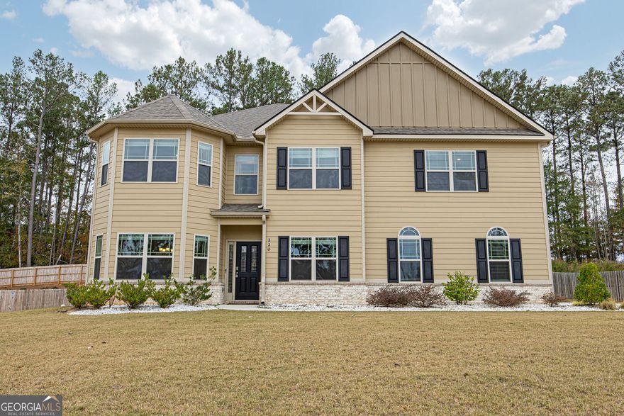 Welcome to this stunning 6-bedroom, 4.5-bath home in beautiful Senoia. Built in 2021, this modern two-story home offers 3,852 sq ft of thoughtfully designed living space and a true golf cart lifestyle.    Step inside to find a bright, open floor plan featuring a formal dining room, a family room with a cozy fireplace, and an inviting eat-in kitchen. The kitchen is a chef's dream with an oversized island, double wall oven, gas stove, granite countertops, a large walk-in pantry, and a mudroom conveniently located off the garage entry.    The primary suite is located on the main level and features a spa-inspired bath with double vanities, a separate soaking tub and shower, and a spacious walk-in closet. A main-level powder room and laundry room add everyday convenience.    Upstairs, a large loft provides the perfect flex space for a media room, home office, or play area. Five generously sized bedrooms complete the upper level, with four of them thoughtfully connected by two shared Jack and Jill bathrooms, ideal for family living or guests. Multiple walk-in closets throughout offer plenty of storage space.    Outside, enjoy the covered back porch and a two-car garage with additional rear space perfect for storage or your golf cart. The neighborhood features resort-style amenities including a community pool, playground, and fitness area, all for just $500 per year.    Located minutes from downtown Senoia's charming shops, dining, and local events, this home perfectly combines comfort, functionality, and convenience.    Experience golf cart living at its best and schedule your showing today!