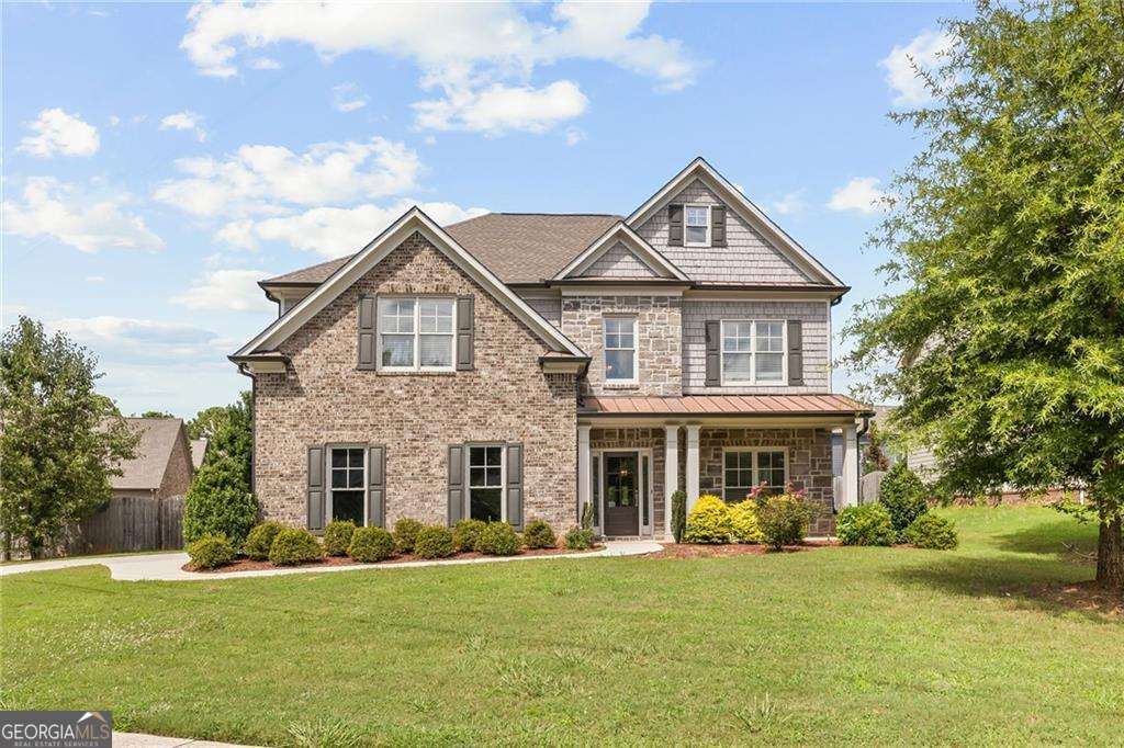 Oh honey, you've been looking for the one, the home that has the space, the style, and the story... buckle up buttercup because 2742 Bob Bettis Road is a rare opportunity in one of East Cobb's most sought-after communities! This brick-front beauty is tucked away on an oversized, private, fenced lot and offers nearly 3,300 square feet of smart, sophisticated living. With 6 bedrooms and 4 full baths, this home is ideal for growing families, multi-generational living, or first-time buyers ready to settle into something special. From the moment you step inside, you're greeted by soaring ceilings, a two-story foyer, and sunlight-filled spaces that flow effortlessly from room to room. The formal living and dining rooms set the stage for gatherings, while the chef's kitchen is the heart of the home, complete with stained cabinetry, granite counters, stainless steel appliance package, farm sink, large island, and a walk-in pantry. Need a flex space? The main-level bedroom with full bath is perfect for guests, a playroom, or a chic home office. The oversized fireside family room invites you to kick back and relax in style. Upstairs, the primary suite is pure bliss with a spacious sitting area, double walk-in closets, and a spa-worthy bath featuring 12x24 tile, granite vanities, soaking tub, and a semi-frameless shower. You'll also find four additional guest bedrooms, two more full baths, and a bonus media room, no carpet, just sleek hardwoods and stylish tile underfoot! And when it's time to head outdoors? Fire up the grill on your patio, let the pups run in the fully fenced backyard, and savor those easy East Cobb evenings under the stars. Largest floor plan in the neighborhood. Top-tier finishes, incredible value, unbeatable location. Come see what makes this home truly shine... because this isn't just another listing... it's your next chapter waiting to be written.