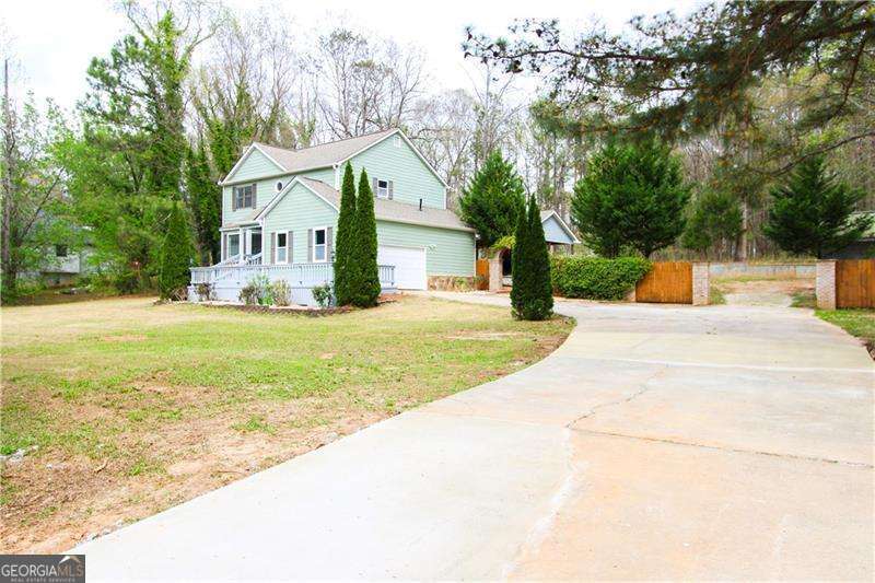 *Back to the market, no fault of the seller.* Welcome to this beautiful, well-maintained, move-in-ready home. The great curb appeal welcomes you in, while the front porch invites you to sit back and enjoy the pine trees surrounding the front yard, offering a beautiful view and privacy and offering three spacious bedrooms and 2.5 bathrooms. The exterior of the home features an expansive driveway for ample parking and a serene backyard with a gazebo measuring 24' x 30'. The gazebo features a fireplace with an electric system already in place, perfect for outdoor activities and entertaining. This home is located in a beautiful neighborhood with no HOA, conveniently located just minutes from schools, shopping, and the I-75 interstate for easy commuting.