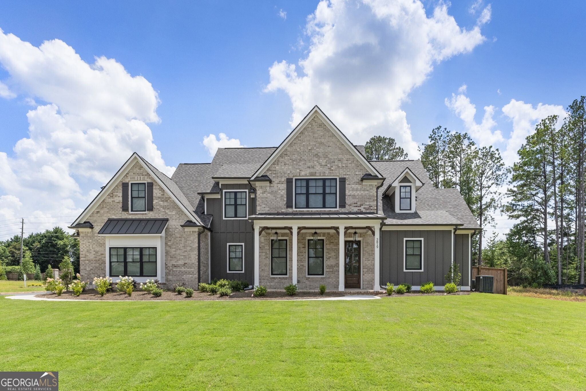 Discover a rare opportunity to own a newly built, move-in ready home in Lassiter Cove, thoughtfully developed by Cotton States Properties. This home offers a seamless blend of functionality and elegance, designed for both everyday living and effortless entertaining. Step into an expansive open floor plan featuring a gourmet kitchen with a stunning island overlooking the family room and outdoor kitchen-perfect for hosting gatherings. The spacious primary suite is a true retreat, showcasing a spa-inspired bathroom with a zero-entry, oversized shower. Additionally, the main level offers a secondary ensuite bedroom, ideal for guests or multigenerational living. Enjoy outdoor living at its finest with a fully fenced, private, flat backyard-ideal and ready for a future pool. Additional designer details include cedar beams, shiplap accents, gorgeous woodwork, and a striking brick fireplace, wood blinds, custom closets, adding warmth and character throughout. Upstairs, you will find three additional bedrooms and a spacious loft, providing flexible space for a media room, playroom, or home office. This home delivers a move-in ready lifestyle in one of the area's most desirable communities, just moments from top schools, parks, and shopping.