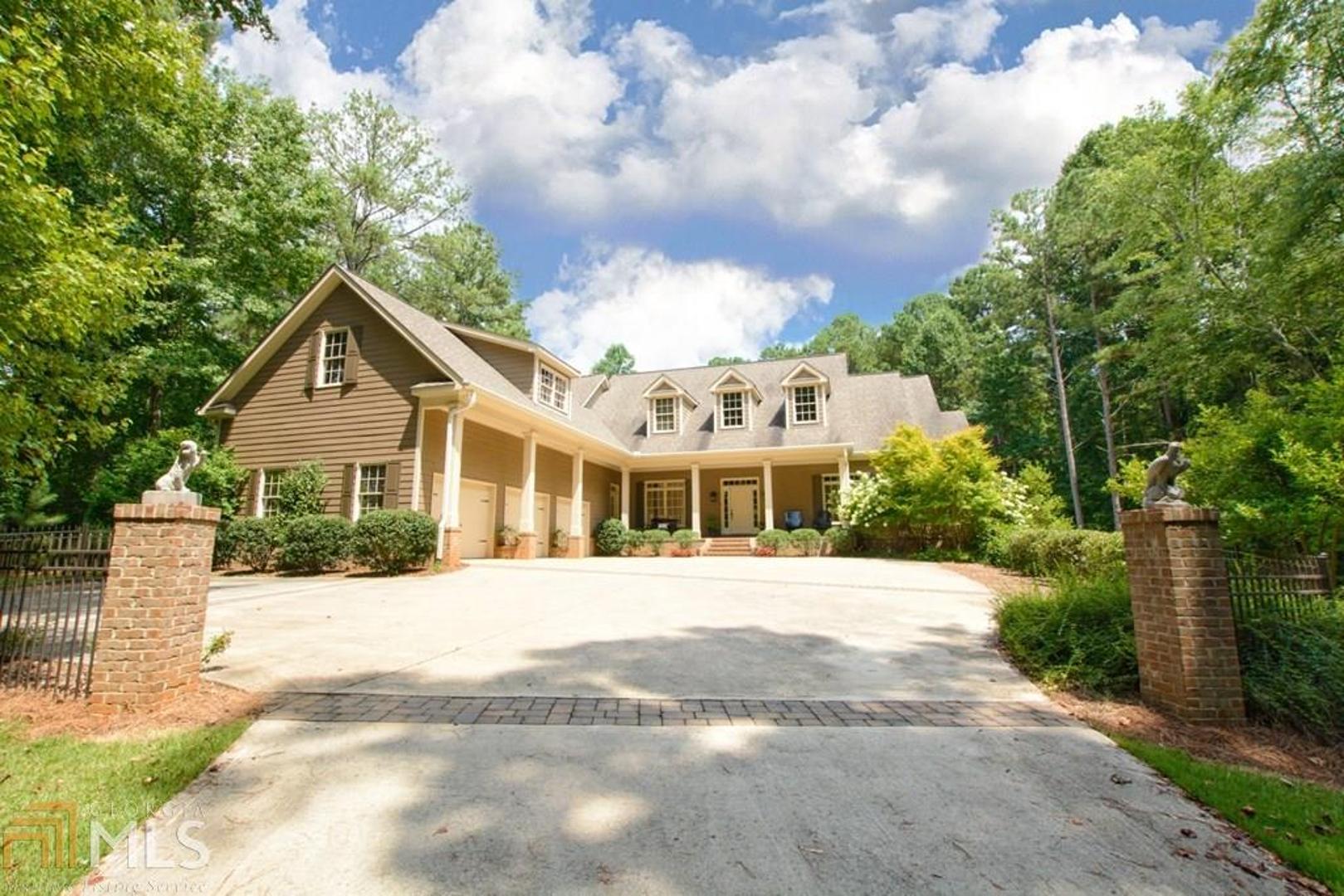 If you are looking for a charming estate designed with southern living details, welcome home! The winding driveway adorned with professional, mature landscaping offers additional privacy in Carrollton's exclusive gated community. Relax on the front porch or enjoy your backyard retreat with covered patio overlooking custom saltwater pool. The main level boasts a luxurious master suite and an addl bedroom/office area with full bath. An oversized bonus area is perfect for storage or complete its interior finishes for a playroom, game room, or home theater. The unfinished basement area gives you endless options for addl living and entertaining spaces for your growing family and the 3-car garage and double parking pad complete this home.