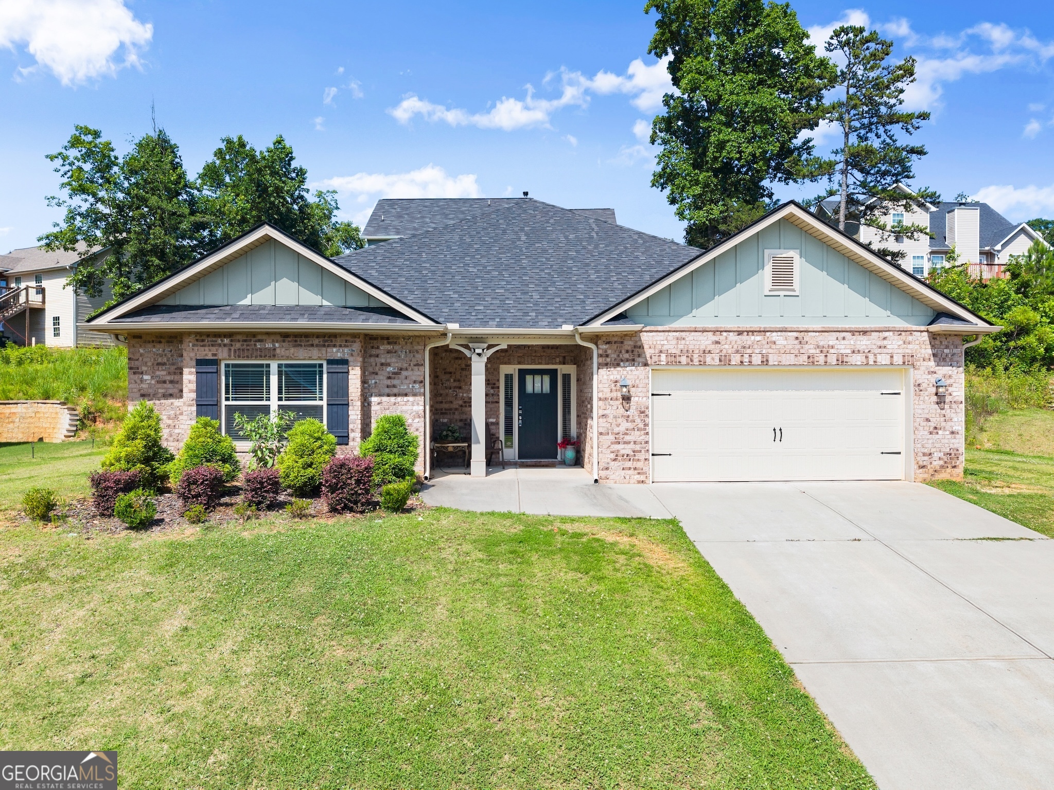 Tucked away in a quiet pocket of Commerce, this 4-bedroom, 2-bath ranch brings comfort, style, and low-maintenance living together in one beautiful space. As soon as you walk through the oversized entryway, the home opens up into an airy, light-filled layout that feels instantly welcoming. The heart of the home is the open-concept kitchen, dining, and living room-anchored by a spacious island with granite countertops, stainless steel appliances (yes, the fridge stays!), and plenty of windows that flood the space with natural light. It's the perfect setup for everyday living and easy entertaining. The bedrooms are one of this home's biggest surprises-all four are generously sized, giving everyone space to spread out. The split-bedroom floor plan means you get a little peace and quiet in the primary suite, even when the rest of the house is full of life. The bathrooms continue the thoughtful design with quartz countertops, upgraded finishes, and a mix of comfort and function that's hard to find in newer homes. Outside, the backyard is private and low-maintenance-just enough green space to enjoy without spending your weekends on yard work. Add a grill, a couple of chairs, or a garden box and you've got a peaceful outdoor escape. The house also features smart home upgrades, a finished garage, and thoughtful touches like ceiling fans, upgraded trim, and 2" faux wood blinds throughout-details that make a difference every single day. And when you're ready to step outside the front door? You'll find a sidewalk-lined neighborhood with streetlights, a community pool for hot summer days, and a neighborhood pond perfect for quiet walks or fishing. Banks Crossing is just minutes away, so all the shopping, dining, and conveniences are close by-without sacrificing that tucked-away, peaceful feel you've been craving. If you've been waiting for a home that's functional, beautiful, and ready to love-this might just be the one. Please note: This property is a short sale and being sold strictly as-is.
