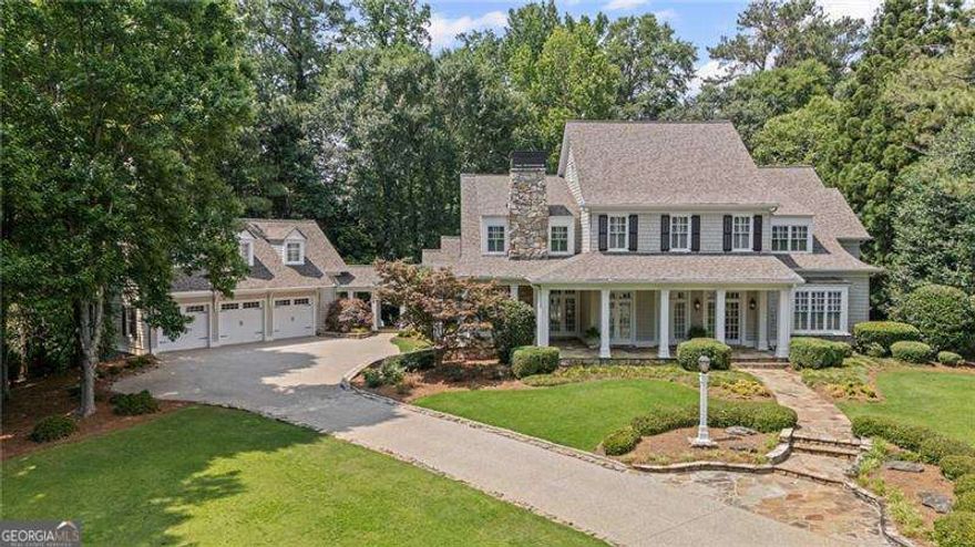 Welcome to an exceptional living experience, where timeless Southern charm seamlessly meets refined New England elegance. Nestled in the exclusive Bailey Estates neighborhood, this custom-built home has over 8000 sq. ft. 6 bedrooms and 7 bathrooms, and is set on a private 1.2-acre cul-de-sac lot. Included with this home is an 880 sq. ft. space, with split HVAC system, above the garage, that can be utilized as a studio, office, or an additional 7th bedroom complete with a full bath bringing the total number of baths to 7. The allure of a home often begins with the first glance, and this particular home does not disappoint. The exterior facade, adorned with a blend of stone and cedar shake siding, sets the tone for a residence that exudes both elegance and warmth. As you approach the entryway, the front porch extends a warm welcome. Upon entering the home, you are greeted by the stone floor in the foyer which is a testament to the craftmanship and character throughout.  This home offers spacious, light-filled living areas featuring 12-foot ceilings, custom moldings, wide-plank heart pine floors and 6 fireplaces.  To the right of the foyer is a library/study perfect for reading and relaxing. To the left is the dining room which seats 12 comfortably making it the perfect spot for intimate gatherings or extravagant dinner parties.  As you continue inside the home, you find an elegant living room with coffered ceilings, fireplace and french doors leading outside to the stone patio complete with a cozy outdoor fireplace perfect for cool fall evenings. The heart of the home boasts a chef's kitchen designed for both functionality and design with dual islands, a sub-zero refrigerator, dual dishwashers, maple wood cabinets, a copper apron sink and walk in pantry.  Enjoy an open view of the family room with a beamed ceiling, custom cabinetry, and a stone fireplace, for intimate gatherings. The breakfast room highlights beautiful hanging light pendants, plenty of space and overlooks a private backyard. The oversized primary bedroom on the main floor features coffered ceilings, lots of natural light and a spa-inspired ensuite with a soaking tub, separate shower, dual vanities and two large walk-in closets.  Upon entering from the garage and through the covered breezeway/portico, you are greeted by a spacious laundry room equipped with a sink and can accomodate extra refrigerator adding to the overall efficiency of the home. The powder room is designed with style and convenience in mind, blending effortlessly into the main level's aesthetic. Take the stairs to the upper level where you'll find an open landing adorned with built-in bookcases. This floor boasts four generously sized bedrooms, each featuring a private bath to ensure both comfort and privacy. A media/study room with a wood-burning fireplace provides a serene space for work or relaxation. The expansive terrace level features a vast entertainment space, two additional flex rooms, a bedroom, full bath, and ample storage completing this versatile level, offering endless possibilities for customization. The terrace level seamlessly flows to the outdoors, featuring a walk-out stone patio and a private yard. Additional highlights include a spacious three car garage, recent house painting inside and out, repaved driveway, refinished kitchen floors and an irrigation system. Great location near Dunwoody Country Club, premier shopping and dining. Don't miss the opportunity to call this home!