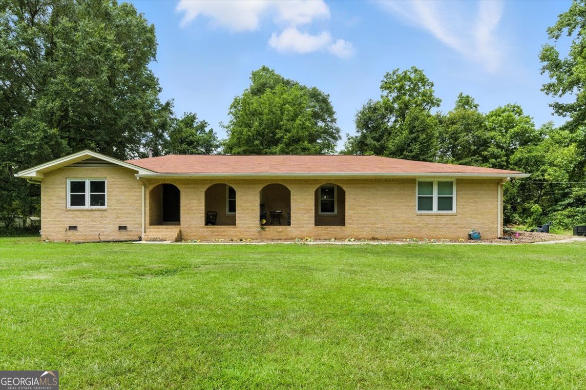 This salient 6.7-acre property features a USDA Certified Farmhouse (Certification #448, Tract #478), offering both charm and agricultural potential. The estate includes two expansive, fenced greenhouses, ideal for year-round cultivation. The beautifully maintained ranch-style residence offers 2 bedrooms and 2 full bathrooms, thoughtfully designed for comfort and functionality. The home is situated adjacent to a serene, active brook, providing a peaceful and picturesque natural backdrop. Interior highlights include: Modern kitchen equipped with stainless steel appliances. Recently installed HVAC system for enhanced energy efficiency. Premium LVL flooring throughout the home. Double-pane windows with a transferable lifetime warranty. Elegant coffered ceilings and recessed lighting for a refined aesthetic. Ceiling fans installed throughout for added comfort. Outdoor living is elevated by a generously sized, stained family deck-perfect for entertaining or relaxing. The property is enriched by a variety of mature, fruit-bearing trees, including walnut, mulberry, muscadine, and other seasonal varieties. This estate offers a rare combination of rural tranquility, modern amenities, and agricultural readiness.
