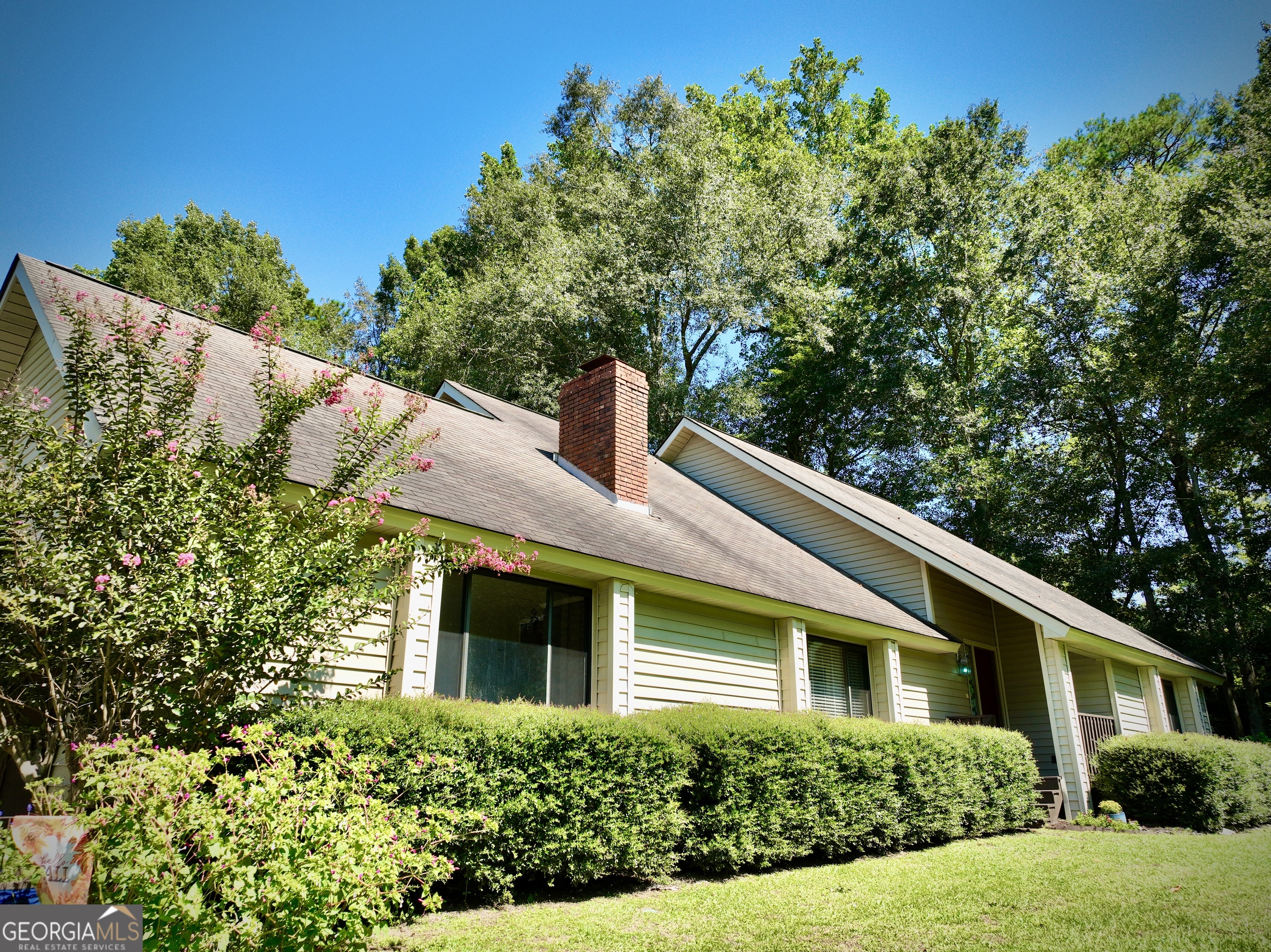 Spacious 4 bedroom, 2.5 bathroom home on 2.9 peaceful acres in the county with it's very own pond. This calming and serene property offers plenty of room for everyone, including a versatile 5th room that can be used as an office, craft room, or additional bedroom. Inside you will find a den and a family room with a cozy fireplace, plus an eat in kitchen, large loft area upstairs, and a master suite on the main level. Outside, enjoy the big yard complete with a tire swing, additional detached carport, covered back patio, large workshop, and beautiful views of the pond.