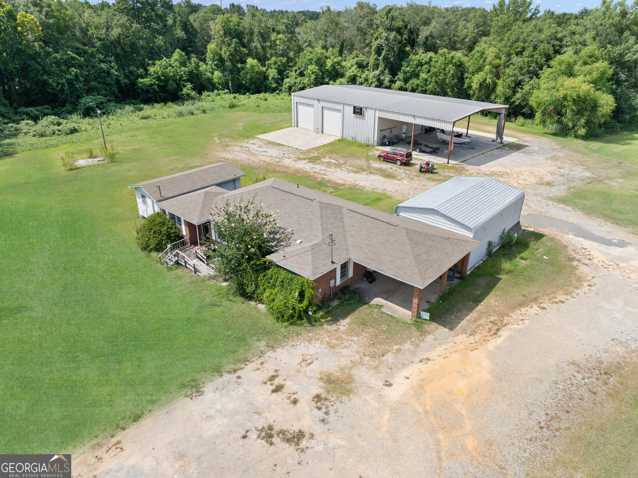 Fabulous commercial location at the corner of Circle Drive and Highway 80 with tons of drive-by traffic. This listing includes a duplex, warehouse/shop, brick office building/house, and two additional lots bringing the total acreage to 4.36 acres.