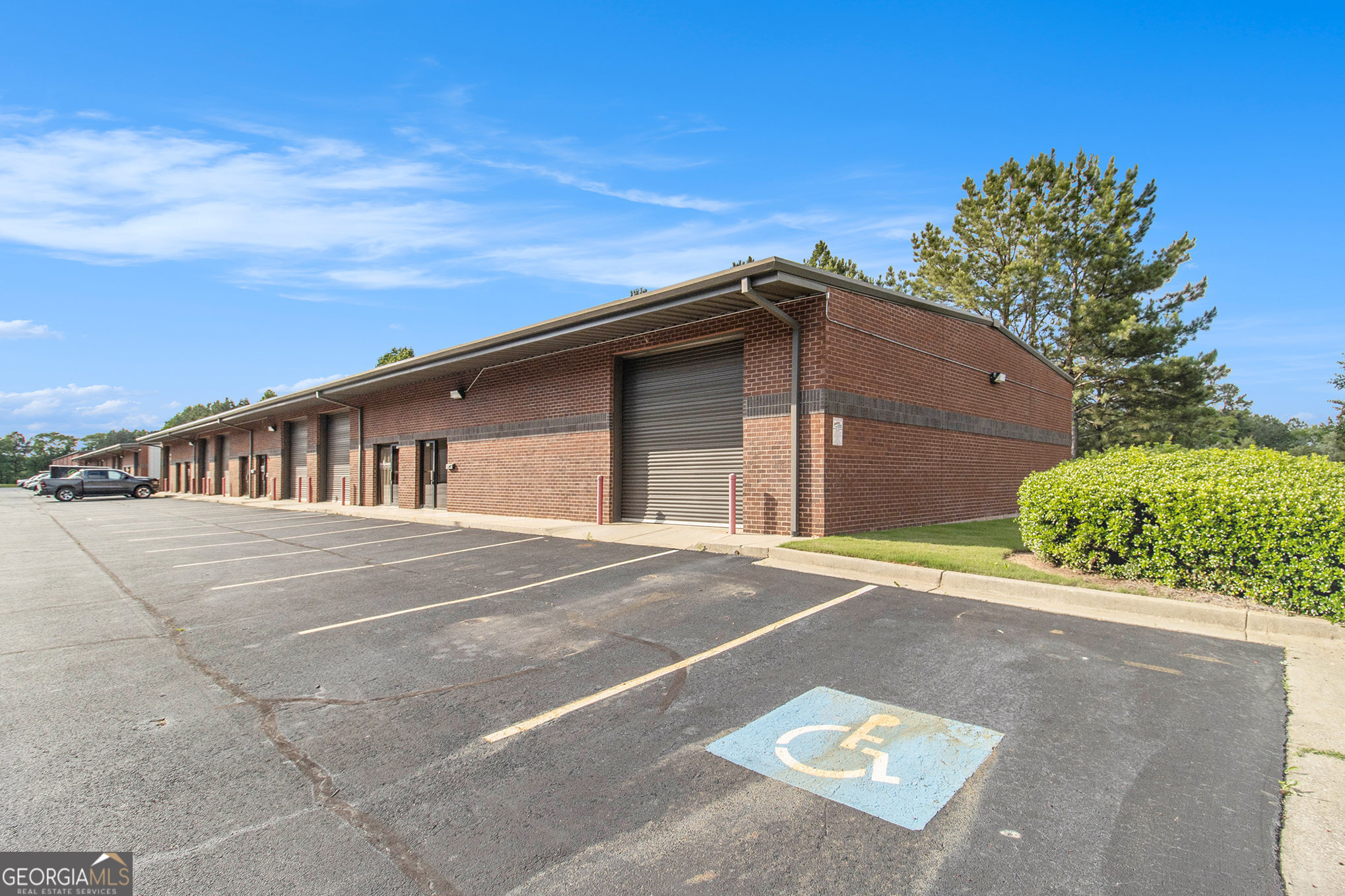 For Sale: Office / Warehouse Space 741 Harry McCarty Rd, Unit 101, Bethlehem, GA (Barrow County). This versatile, single-story building is located just 1/10th mile off GA 316/University Parkway. This professional business park is in a prime, high-traffic area. Situated on the corner, this Unit benefits from high visibility and easy accessibility to parking spaces for guests and staff. The single-story layout ensures ease of access, with no stairs. Unit 101 includes a front 3'0" pedestrian door with a side glass window, offering convenient access and natural light. Additionally, the front is equipped with a 12'x12' drive-in roll-up door, ideal for larger vehicles or equipment leading into a warehouse with clear ceiling height between 14' and 16', providing ample room for various operations. There is 600 SF within 3 offices plus 1900 SF in the warehouse. The property is zoned M1 for Light Industrial District, M-1 zoning permits light industrial uses, including manufacturing, processing, assembly, and storage of materials and equipment for commercial use, making it ideal for a wide range of professional services that need more than just office space. All automotive businesses are prohibited. Property is Leased through 7/31/2030 with a NNN Lease, 3% Annual Escalation, 8.16% ROI in 2025 & 9.55% in 2030. For more information or to schedule a viewing, please contact AGENT.