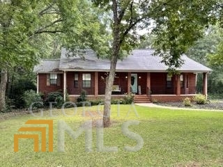 Great All-Brick Ranch Style Home with Full Finished Basement in Locust Grove School District! This Home Features 3 Bedrooms, 3 Full Baths, and 1 Half Bath! 2 Master Suites on Main Level - Perfect for a Teen or In-Law Suite! Quiet, Corner Lot with Plenty of Outdoor Space! Updated Granite Counters in Kitchen! Covered Back Deck Overlooking Fenced in Yard. Finished Basement Features 1 Bedroom, 1 Full Bath, Wet Bar, and Living Room with Fireplace! Convenient to Shopping and the Interstate!