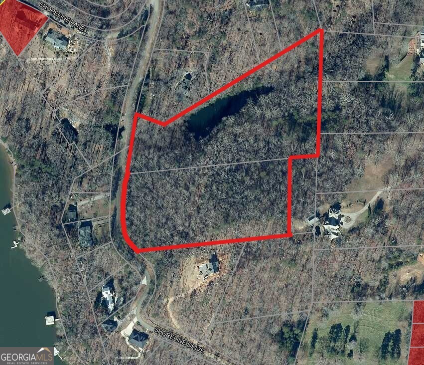 Discover the perfect blend of natural beauty and privacy with this 11 acre tract in highly sought-after North Hall. Featuring a serene, stream-fed pond and sweeping panoramic views from the hilltop, this property offers an ideal setting for your dream home, private retreat, or mini farm. Enjoy the peaceful ambiance of rolling acreage with a mix of open areas and natural landscape, all while being conveniently located near schools, shopping, and Lake Lanier. Rarely does a property combine breathtaking vistas and water features in such a prime location-don't miss this opportunity!