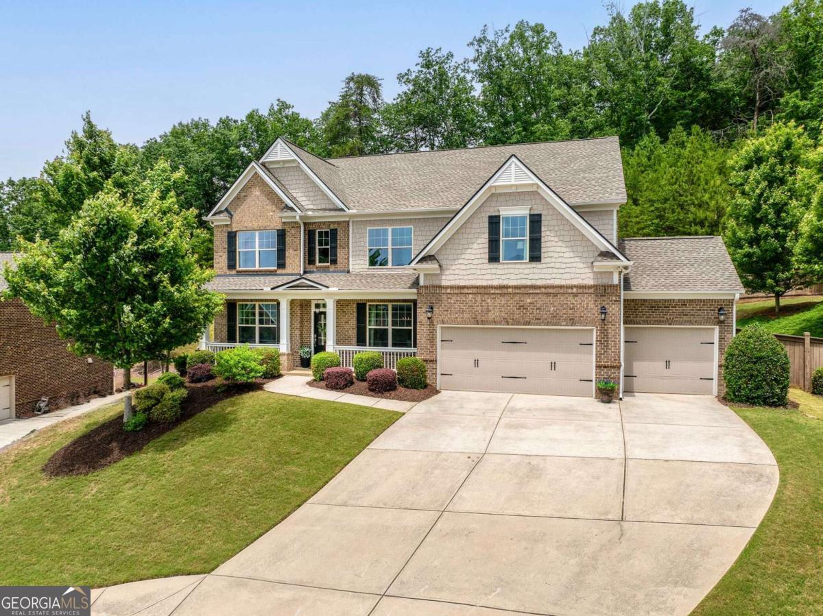Now available in the highly sought-after Wigley Preserve community of Marietta, this stunning 6-bedroom, 4-bathroom home perfectly blends luxury, functionality, and thoughtful design. Situated on a quiet cul-de-sac with a picturesque view, the property boasts a three-sided brick exterior, a spacious three-car garage with loft storage and soaring ceilings, and a private fenced yard with ample room for a pool, playset, or firepit. A new roof and a recently replaced HVAC system add peace of mind, while the large back deckCowith its built-in planters, seating, and a charming gazeboCooffers the ideal setting for outdoor entertaining. Inside, you'll find 9-foot ceilings and hardwood floors throughout most of the main level, along with rich custom woodwork that brings warmth and character to every room. The kitchen is a chefCOs dream, featuring double islands, a custom tile backsplash, and a generous eat-in area that flows beautifully for everyday living and gatherings. Thoughtfully designed custom built-ins enhance both the mudroom and living room, while a large bonus room adds flexible space for work or play. One of the standout features is a second primary bedroom on the main level with its own private ADA accessible en-suite designed for easy accessibilityCoperfect for multigenerational living, guests, a teen suite, or even a playroom. The upstairs primary suite includes a luxurious bath with a soaking tub, separate shower, and a custom closet system for effortless organization. Zoned for top-tier schoolsCoDavis Elementary, Mabry Middle, and Lassiter HighCothis exceptional home delivers space, style, and comfort in one of East CobbCOs most desirable neighborhoods.