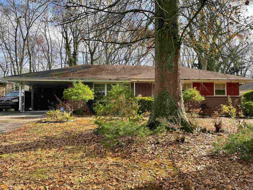 Conley Hills specialty with some really great features: Check out the vaulted sunroom, large eat-in kitchen, storage and laundry room off carport leading to the kitchen, beautiful hardwood floors, pine paneled den/3rd bedroom, french doors in a number of the rooms, 2 full baths with shower in primary bedroom, deck and it does need repair, storage shed, fenced backyard and it is huge. The 2nd bedroom was opened up to be a walk-in closet but easily able to be converted back to a private bedroom. Yes, updates are needed but really in very liveable condition!