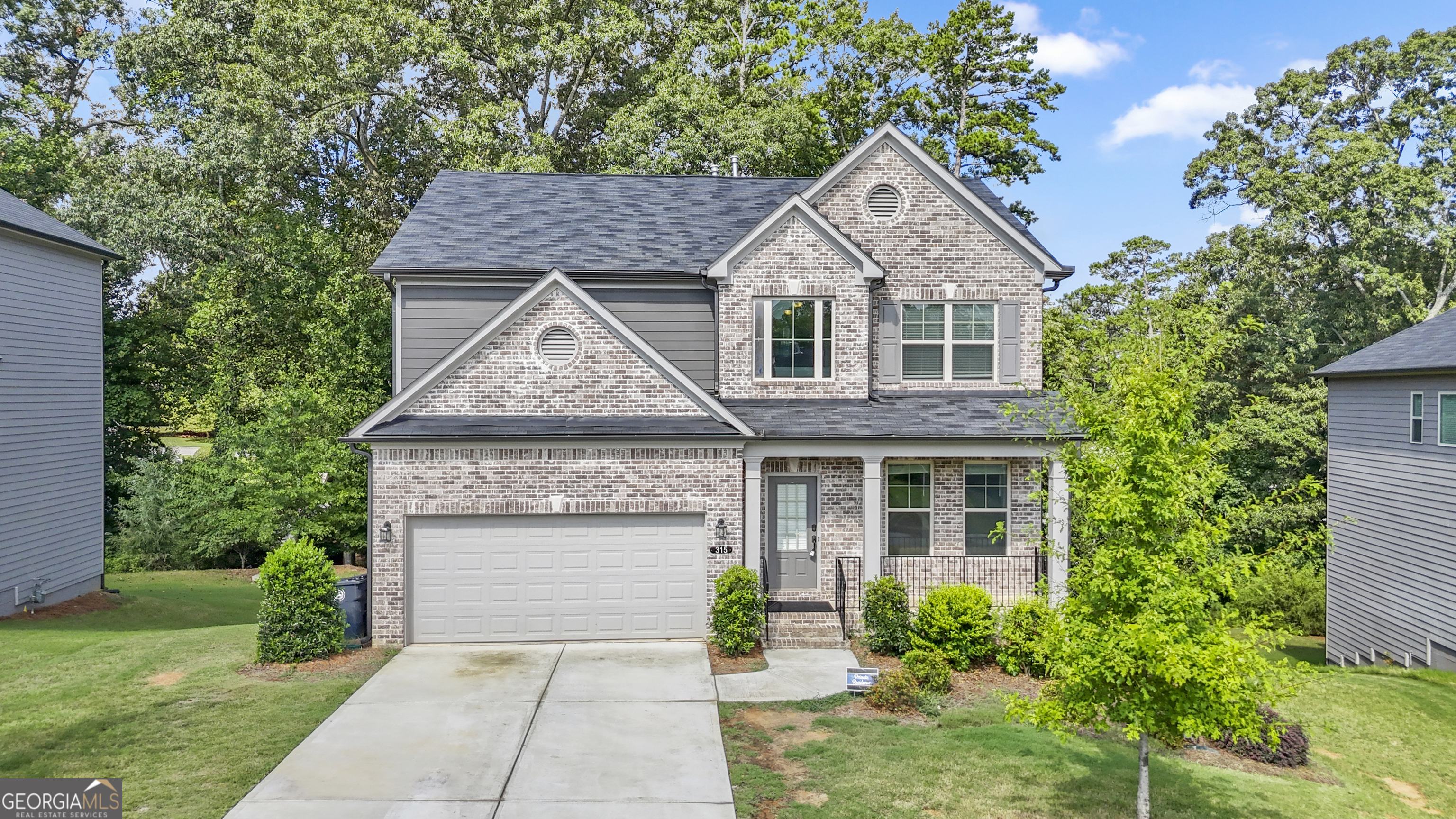 Stunning 5-Bedroom Home in Sought-After Hudson Cove on Lake Lanier! Welcome to a beautifully designed 5 bedroom, 3.5 bath home offering over 3,000 sqft of elegant living space in the desirable Hudson Cove community. Perfect for entertaining or simply enjoying spacious, comfortable living, this home combines modern style with thoughtful functionality. The heart of the home is a gourmet kitchen featuring sleek quartz countertops and an open concept that flows into the spacious family room - ideal for gatherings. Upstairs, the expansive master suite is a true retreat, joined by three additional bedrooms and a full bath with double vanity. Basement with One bedroom and a full bath, separate living room. HOA includes lawn maintenance, offering low-maintenance living in a prime lakeside setting. Don't miss this rare opportunity to own a lake-access home in a peaceful, well-maintained community! Located just steps from Thompson Bridge Park and the shores of Lake Lanier. Enjoy the convenience of being close to top-rated schools, shopping, dining, and I-985 for easy commuting.