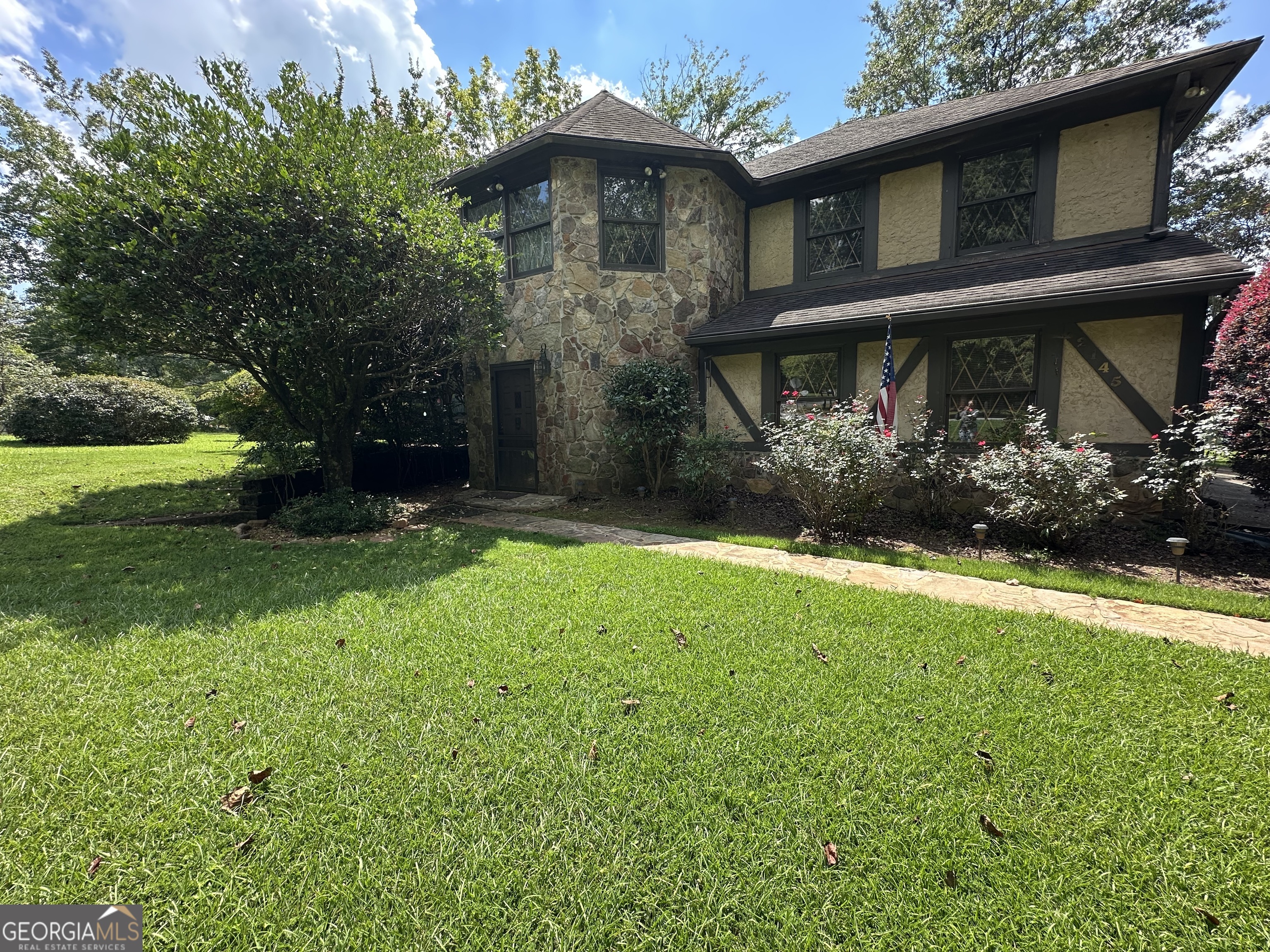 **Custom Built One Owner Home on an Amazing Waterfront Lot in Great Established Neighborhood**Just waiting on a new owner to come in and update this wonderful home. This home has so many unique and well thought of features - Main Level features Beautiful Foyer Entrance with Gorgeous Stone Floors that continue into Family/Sun room with a wall of windows looking over lake as well as Laundry Room that also has a full bath and separate entrance - Built in Bar off of Foyer -Two car garage - Second Level Features Huge Family Room with Fireplace and Triple Windows for tons of natural light - Off of family room is a formal dining room that also opens up to kitchen- Large kitchen with tons or cabinets and counter space and an eat in area with a stone fireplace - French doors opening from kitchen onto huge deck overlooking the lake for all of your entertaining or just sitting outside watching the most beautiful sunsets - Upstairs you will find two large secondary bedrooms with tons of closet space - One of the bedrooms has a sitting area as well as extra closet - Tile hall bath - Master bedroom with awesome Master bath that includes Two closets as well as two vanities, nice shower and tons of space for storage - Close to schools, shopping , restaurants and interstate - Just needs a buyer to come in and make it their own with their updates - Seller is in process of Estate Sale so there is still alot of furnishings and things in property