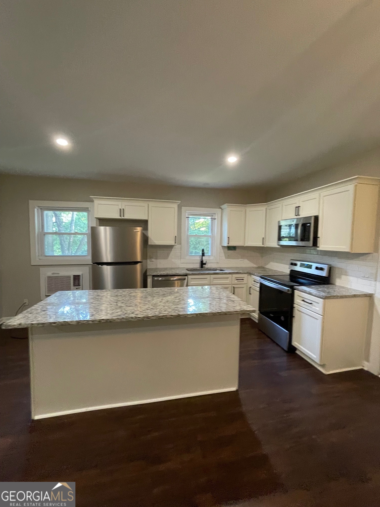 Welcome to your new home in the heart of Carrollton City! This recently updated one-bedroom, one-bath apartment offers a perfect blend of modern comfort and convenient living with the unique character of a historic home built in 1895. Large 15' x 15' bedroom with 11' ceilings, flex room/office and spacious kitchen with island, stainless steel appliances, granite counters and tile backsplash. Step into a thoughtfully designed space that boasts updated finishes and an inviting atmosphere. Just a short walk to Adamson Square where you'll find great shopping and dining! $65 billed monthly pest control/landscaping.