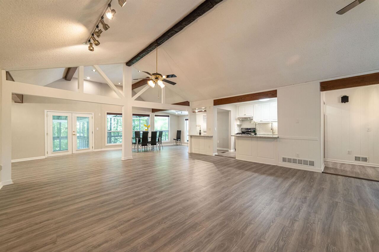 Truly One of a kind Raised ranch on a full finished basement where you can live in the city of Marietta, yet with a flair and feeling of being in the mountains with lots of greenery and privacy. Fantastic Marietta location with new construction homes on the same street selling in high $500s. This open concept 3 bedrooms and 3 full baths raised ranch offers an open and airy family room with fireplace, dining room, raised high ceilings with beautiful structural beams that give this home a cool contemporary look and feeling. Great room with French doors leading to your private balcony - Perfect place to relax in your own privacy and enjoy your cup of coffee, tea in the morning before starting your day or perhaps a glass of wine or a cocktail or another favorite drink of your choice after a long day of work or your daily chores. Home features new floors in living/great room, new SS appliances, new granite counters, new gorgeous back splash, new bathroom vanity in master bathroom, fresh paint throughout; new driveway, double lot with driveway access on both sides, 2 car detached garage, additional 1 car attached garage; storage shed, low maintenance metal roof and more. The full finished basement with 1 bedroom and full bath can be easily converted to the in-law suite with its own private entrance. Price includes the adjoining lot at 651 Suholden Cir which makes it total of 0.56 acres lot. Very quite and stable neighborhood, minutes to shopping and cool restaurants. This home is definitely a MUST see!