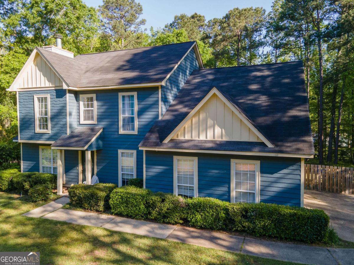 Welcome home to this beautifully designed four-bedroom, two-and-a-half-bath gem nestled in the sought-after Heritage Hills subdivision. The spacious master suite is conveniently located on the main level and features a private bath and a generous walk-in closet! Upstairs, you'll find three additional bedrooms, ideal for family, guests, or even a home office setup. Step outside to enjoy a large, fenced-in backyard and a lovely screened-in porch, perfect for morning coffee or evening relaxation. Pool Community! Just down the road, enjoy easy access to a scenic walking track and West Point Lake, complete with a boat ramp for endless outdoor fun.