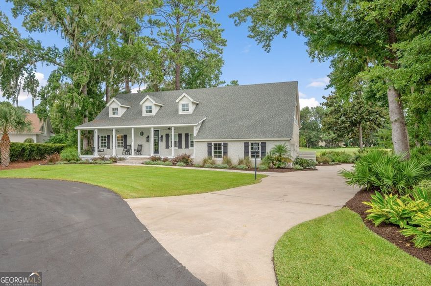 This stunning Saint Simons Island retreat is a true NATURE LOVER'S PARDISE offering breathtaking views of the fourth green and serene lagoon. Set in a private cul-de-sac with just five homes, it's surrounded by lush landscaping and a privacy buffer for tranquility. Featuring 4 spacious bedrooms and 4.5 baths, the home is ideal for both relaxation and entertaining. The first-level master suite is a sanctuary with a custom 8' x 4' shower. The open-concept layout flows seamlessly from a formal dining room to the great room and gourmet kitchen with an island, butler's pantry, and professional 6-burner range. Natural light floods the home through wall-to-wall windows, highlighting exceptional views. Renovations include upgrades to the roof, HVAC, flooring, and kitchen. For outdoor entertaining , enjoy a 44' x 8' veranda and easy access to the back deck. Additional features: whole-house water filtration, EV charger, and abundant storage. A perfect blend of luxury, comfort, and privacy on Saint Simons Island.