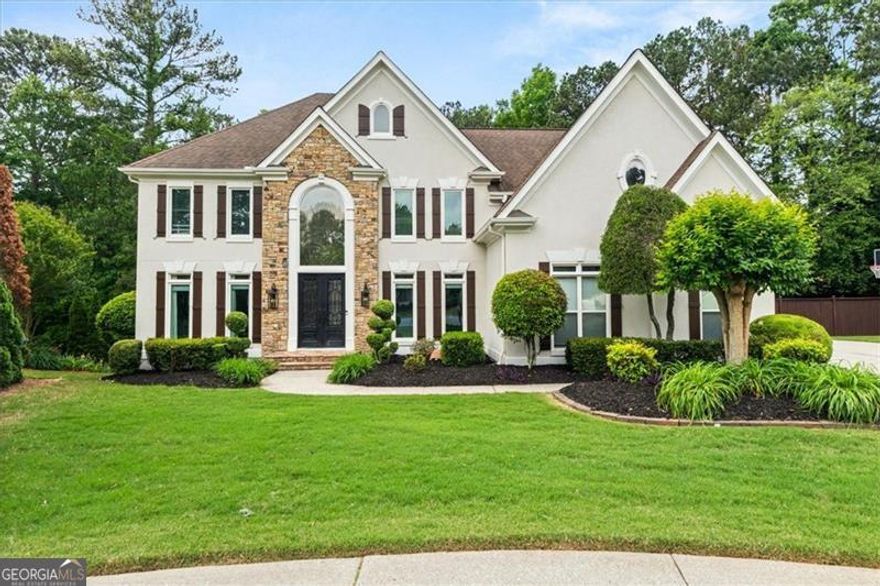 Welcome to 1008 Stream Valley Court - A Rare Gem in the Heart of Park Brooke!  Nestled on a quiet cul-de-sac in the highly desirable Park Brooke subdivision, this stunning residence offers the perfect blend of luxury, comfort, and convenience. Located just minutes from GA 400, Avalon, Downtown Alpharetta, and award-winning North Fulton schools, this home places you in the center of everything while offering the peace and privacy of a premier neighborhood.  Sitting proudly on nearly half an acre, the home features three spacious levels of living designed for modern lifestyles. The finished terrace level is an entertainer's dream-complete with a custom bar, media room, gym, wine cellar, and a few hidden surprises you'll have to see to believe!  Upstairs, discover five generously sized bedrooms, including a luxurious primary suite with its own sitting room, custom closets, and a spa-like bathroom retreat-your own private oasis.  Step outside to enjoy a large deck, covered patio, and an expansive, fenced-in backyard-perfect for hosting unforgettable gatherings, relaxing with family, or creating your dream outdoor living space.  With its unbeatable location, top-rated schools, and an array of high-end features, 1008 Stream Valley Court offers a lifestyle that's as vibrant as it is comfortable.