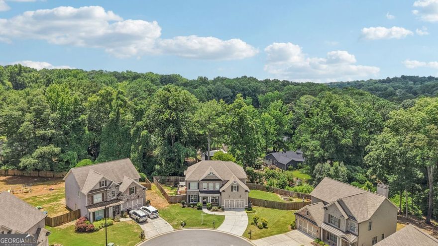 Fantastic Opportunity to Live in the Sought After Hawkins Place Subdivision. This 5BR/3.5 Bath Home is well Appointed with Numerous Upgrades, Bonus Room, Large Fenced Backyard, Covered Patio for Relaxing, Oversized Deck for Entertaining and Sits on a Private Culdesac Lot! This Bright Open Floorplan Has Gorgeous Wide Plank Hardwood Floors Throughout Main. Chef's Kitchen w/Custom White Cabinets, Granite Countertops, Tiled Backsplash, All Stainless Steel Appliances, Built-in Microwave, Dual Ovens, Separate Gas Cooktop, Island, Breakfast Bar, Pendant Lighting, Walk-in Pantry and Breakfast Area w/Chandelier. Dining Room w/Tray Ceiling, Wainscoting, Chandelier and Butler's Pantry. Separate Den/Office Area on Main w/Crown Molding. Family Room with Custom Fireplace, Ceiling Fan and Wonderful Backyard Views. Covered Patio is Perfect for Reading and Relaxing or Entertain on the Oversized Deck Overlooking the Private Fenced Backyard. Large Master Suite Has Tray Ceiling and Fan. Master Spa Has Gorgeous Tiled Floor, Custom Dual Vanity w/Quartz Countertops, Custom Fixtures, Oversized Garden Tub, Subway Tiled Shower and Huge Walk-in Master Closet. Huge Bonus Room Up Makes a Wonderful Rec/Media Room or Potential 5th Bedroom! 3 Spacious Secondary Bedrooms Up, One w/Private Bath and Two Others That Share a Jack-n-Jill! This Home Has Lots of Character and Curbside Appeal! Buyer will Receive a $3,500 Lender Credit with preferred lender JT Trial-Certainty Home Lending