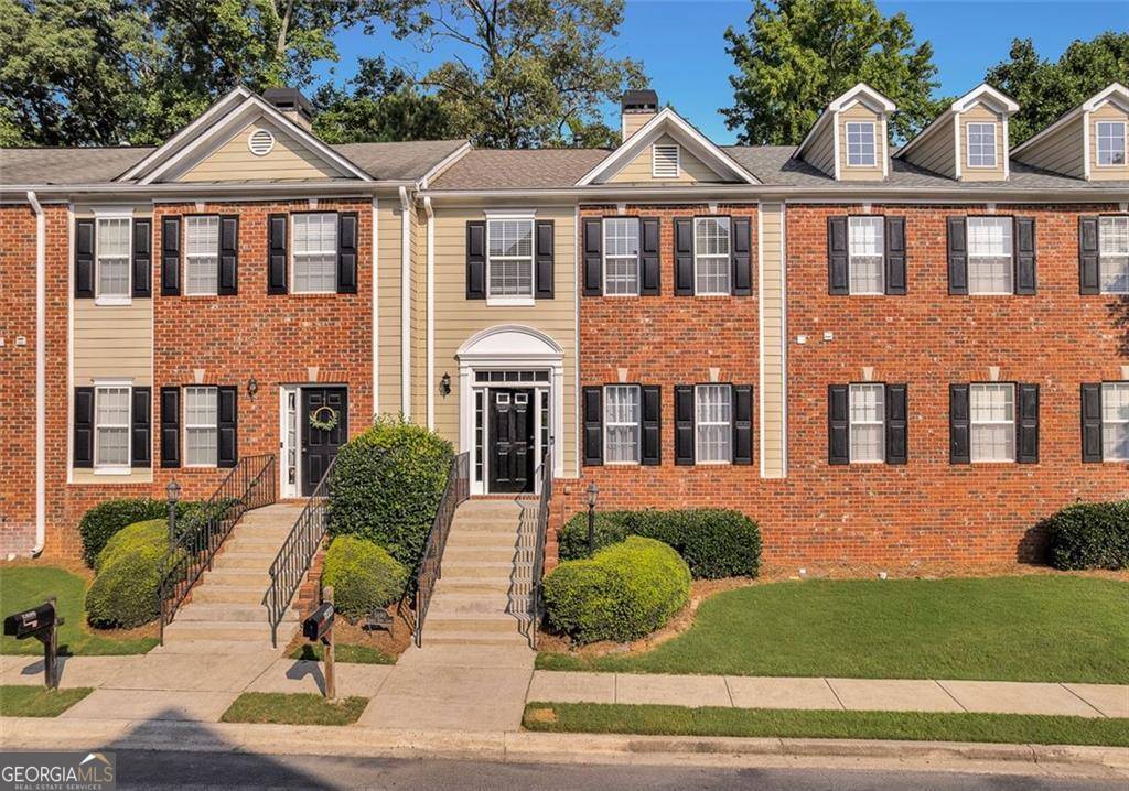 Discover this beautifully maintained 3-level townhome in the heart of Sugar Hill! This move-in ready GEM features a bright and open main level with a spacious living room, crown molding, tray ceiling, cozy fireplace, and abundant natural light. The updated kitchen offers white shaker cabinets, granite countertops, subway tile backsplash, and stainless steel appliances. Enjoy peaceful wooded views from your private deck, perfect for relaxing or entertaining. Upstairs, you'll find a generous primary suite with his & hers closets and a double vanity bath, a secondary bedroom with a full bath. The finished basement includes a large bonus room with a half bath and access to a lower patio-ideal for a home office, guest suite, or gym. Located in a quiet swim/tennis community just minutes from Lake Lanier, downtown Sugar Hill, Suwanee Town Center, shopping, dining, and top-rated schools. Don't miss your chance to call this one HOME!