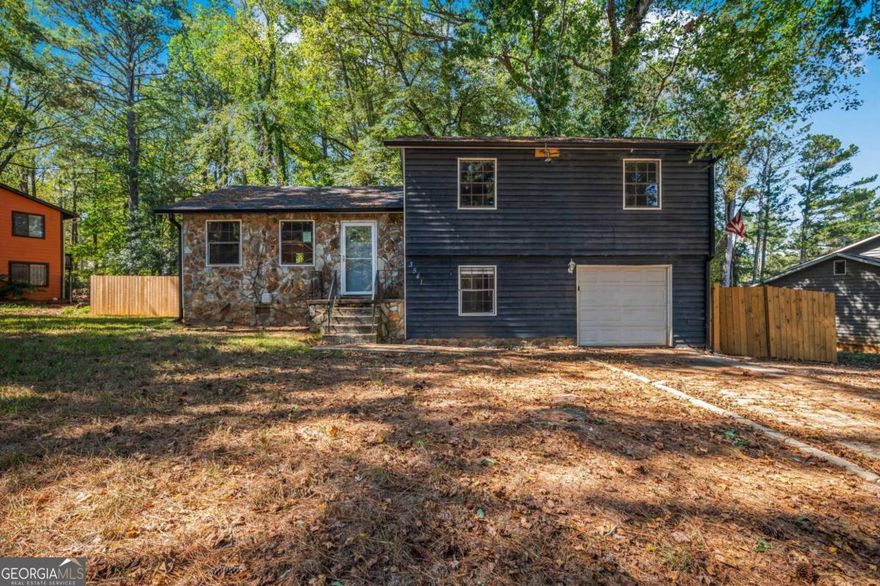 Opportunity Awaits! Welcome to 3541 Santa Leta Drive in Ellenwood-a spacious split-level home with great bones and tons of potential. This property features a partially finished basement, a large rear deck with ramp access, and a functional layout that includes laundry in the garage. While the home does need TLC and updates throughout, it offers a fantastic canvas for customization. Whether you're looking to make it your own or add value through renovation, this home is full of possibilities.