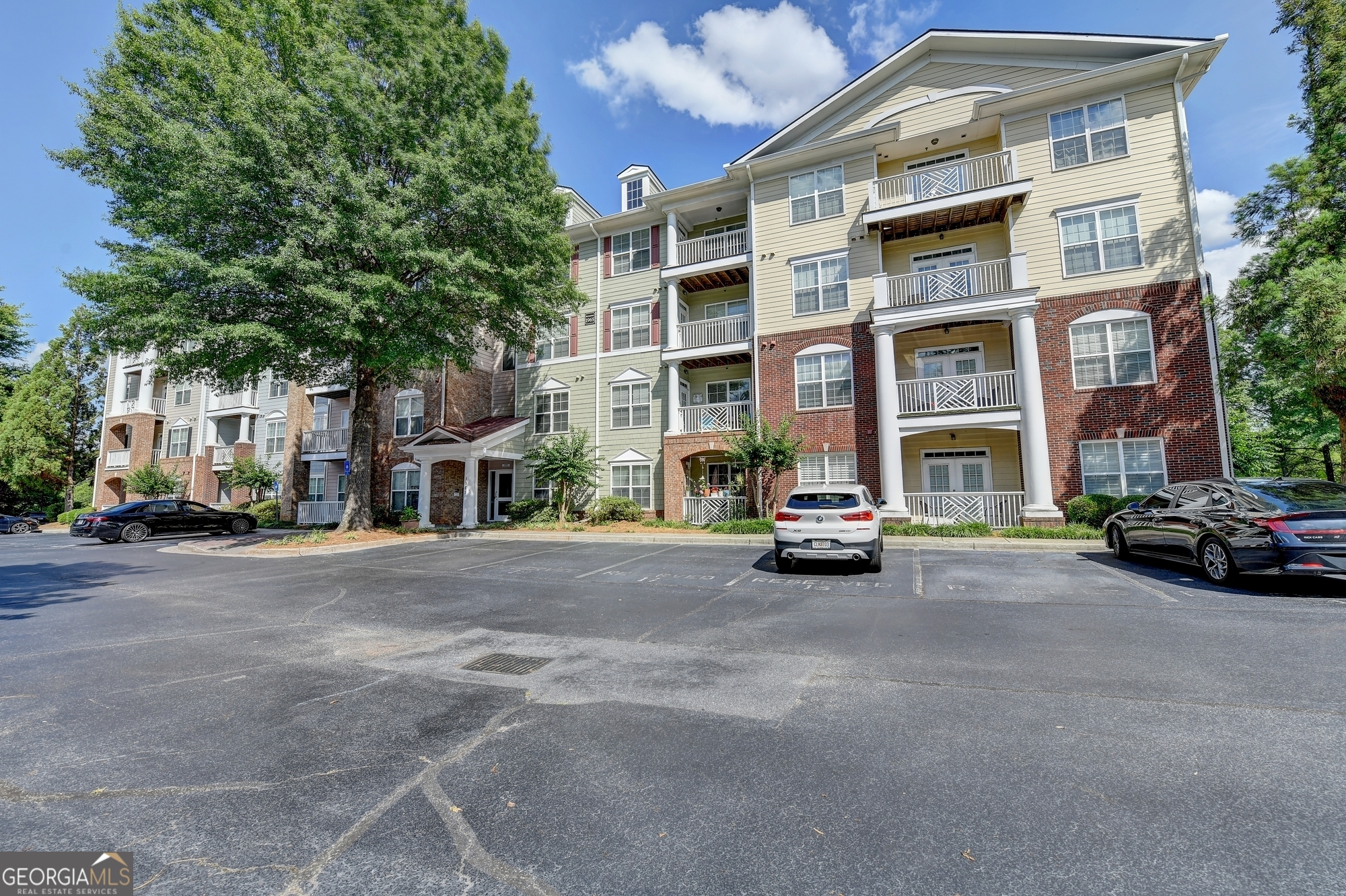 Fantastic Location! Beautiful second floor 2-bedroom, 2-bath condo near downtown Alpharetta and Avalon. Close to Northpoint Parkway Shopping Area, GA 400, walk to Ameris Bank Ampitheater, Fetch Dog Park, parks, Alpharetta Greenway, and access to AlphaLoop. White kitchen with a lot of cabinetry, stainless backsplash, and stainless appliances. Kitchen has open view to the dining and living areas. Gorgeous luxury vinyl plank floors (no carpet) in living and bed rooms plus ceramic tile baths. Bright family room opens to balcony with green view of trees. Split bedroom floorplan with large walk-in closets. Main suite with double vanities, garden tub & shower. Secure access building with elevator. Community amenities, pool, assigned resident parking & plenty of guest parking, professional landscaping. Location, location, location!!