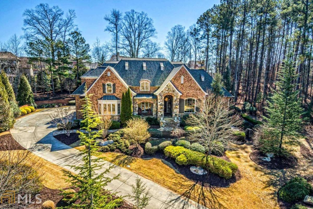 PURE OPULENCE... RIVER CLUB CROWN JEWEL BOASTING ROCK-STAR LUXURY & SUPERB APPOINTMENTS SUCH AS: IMPOSSIBLE TO FIND 4-CAR GARAGES W/ CUSTOM EPOXY COAT FLOORING. SUPERIOR BUILD OF ALL NATURAL STONE & BRICK. OVERSIZED, SPARKLING SALT-WATER HEATED CUSTOM POOL W/ SELF-CLEANING SYSTEM- SITS ON OVERSIZED 1 ACRE PRIVATE FENCED IN LOT W/ GORGEOUS LANDSCAPING- AND VERY GENEROUS SPACE BETWEEN YOU AND HOMES ON EITHER SIDE! ENTER STRIKING CURVED STAIRCASE TO GIANT OPEN-CONCEPT FLOOR PLAN- PERFECT FOR ENTERTAINING. SOARING 10 & 12’ CEILINGS/ OPEN BEAMS/ AND HEAVY TRIM MILLWORK THROUGHOUT... MASTER MAIN IS ABSOLUTELY SPECTACULAR, AND RIVALS ANY HOME WELL INTO $2M+ RANGE- WITH LARGE GLASSWORK OVERLOOKING PANORAMIC VIEWS OF POOL... FRESH FEEL TO CONTEMPORARY NEWLY FINISHED, THICK-PLANK HARDWOODS. FORMAL OFFICE MAIN... GOURMET CHEF’S KITCHEN W/ EVERY LUXURY... UNIQUE ALL BRICK/ VAULTED BREAKFAST ROOM... DESIRABLE STEP-LESS WALK-OUT FROM THE KITCHEN/ GRAND ROOM TO: COVERED PATIO, OUTDOOR FIREPLACE/ ENTERTAINMENT AREA, AND LEVEL ACCESS TO PHENOMENAL POOL... EVERY SECONDARY BEDROOM IS HUGE, WITH ENSUITE UPGRADED BATHS... AND UPPER LOFT OFFICE TOO- WITH SKY LIGHTS...EXTRA-TALL CEILINGS AT FINISHED TERRACE FEATURES: GIANT-SIZE GYM, MEDIA ROOM, ELEGANT BATH, OVERSIZED GUEST SUITE BR, POOL/ GAME ROOM, SAUNA... STUNNING ARCHITECTURAL BEAUTY IN & OUT. HI-PERFORMANCE ROOF SYSTEM. AND HOME WITH WOW EFFECT EVERYWHERE YOU LOOK. AND REASONABLY PRICED!! THE RIVER CLUB IS A NATIONALLY RENOWN, GREG NORMAN SIGNATURE TPC GOLF COUNTRY CLUB... IF YOU’RE SEEKING THE ABSOLUTE ULTIMATE IN COUNTRY CLUB LUXURY, DISTINCTION, AND PERFECTION- IN A PRISTINE HOME THAT FEELS LIKE A BRAND NEW 2021 BUILD- YOU FOUND YOUR WINNER...