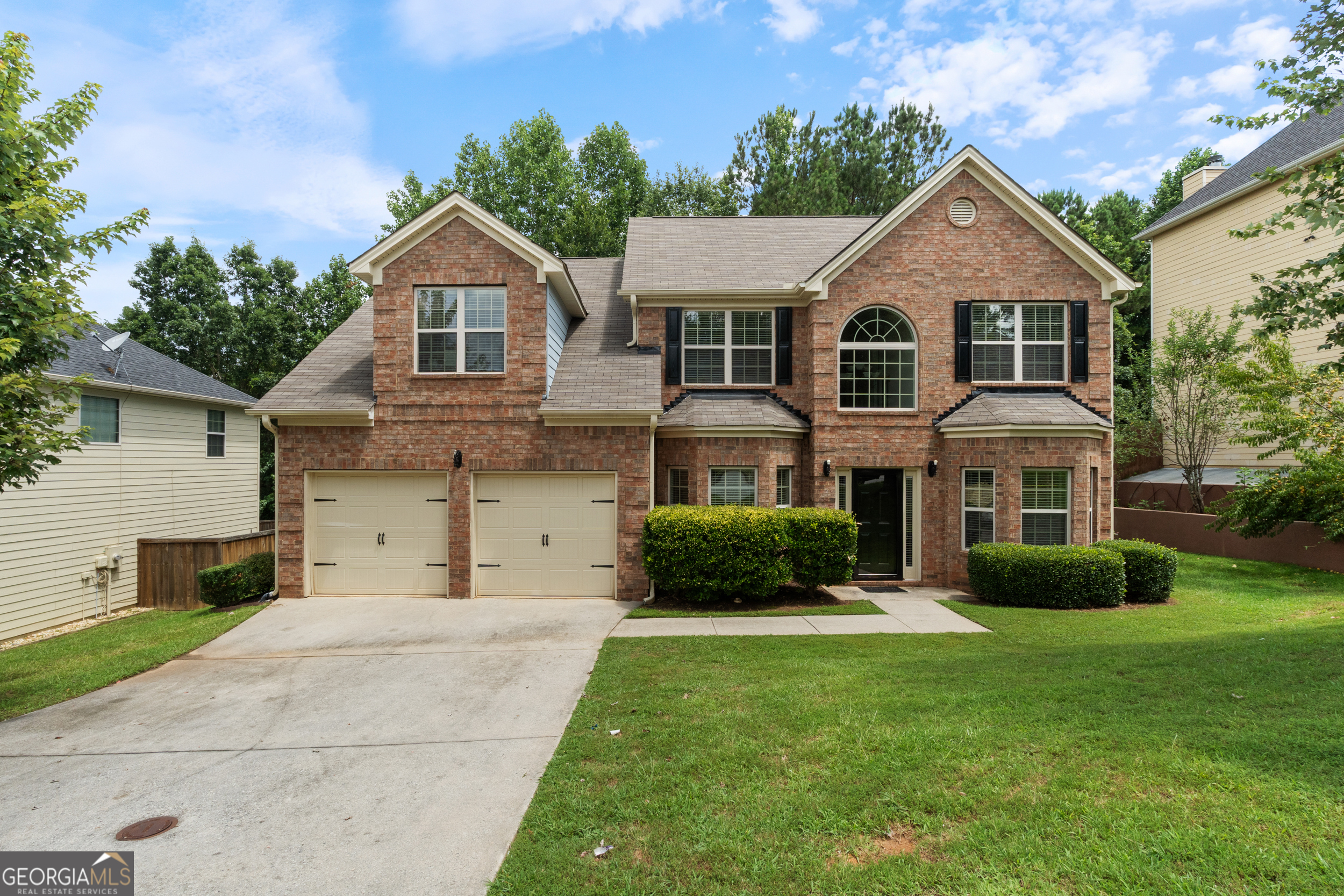 Welcome to 6986 Misttop Loop, located in the highly sought-after Rivertown Mill community of Fairburn, GA. This spacious and well-maintained 4-bedroom, 2.5-bathroom residence offers over 2,300 square feet of thoughtful design and comfortable living. The main floor features a formal living and dining room, a warm family room with a cozy fireplace, and an open-concept kitchen equipped with granite countertops, a center island, stainless steel appliances, pantry, and breakfast area. Upstairs, you'll find a large primary suite with a tray ceiling, a generous sitting area, walk-in closet, and a luxurious en-suite bathroom featuring double vanities, a soaking tub, and a separate shower. Three additional bedrooms and a full bath provide ample space for family, guests, or home office needs. Enjoy privacy and relaxation in the spacious backyard-ideal for entertaining. This home is minutes from I-85, Camp Creek Marketplace, and Hartsfield-Jackson Airport. Don't miss this opportunity-schedule your showing today!