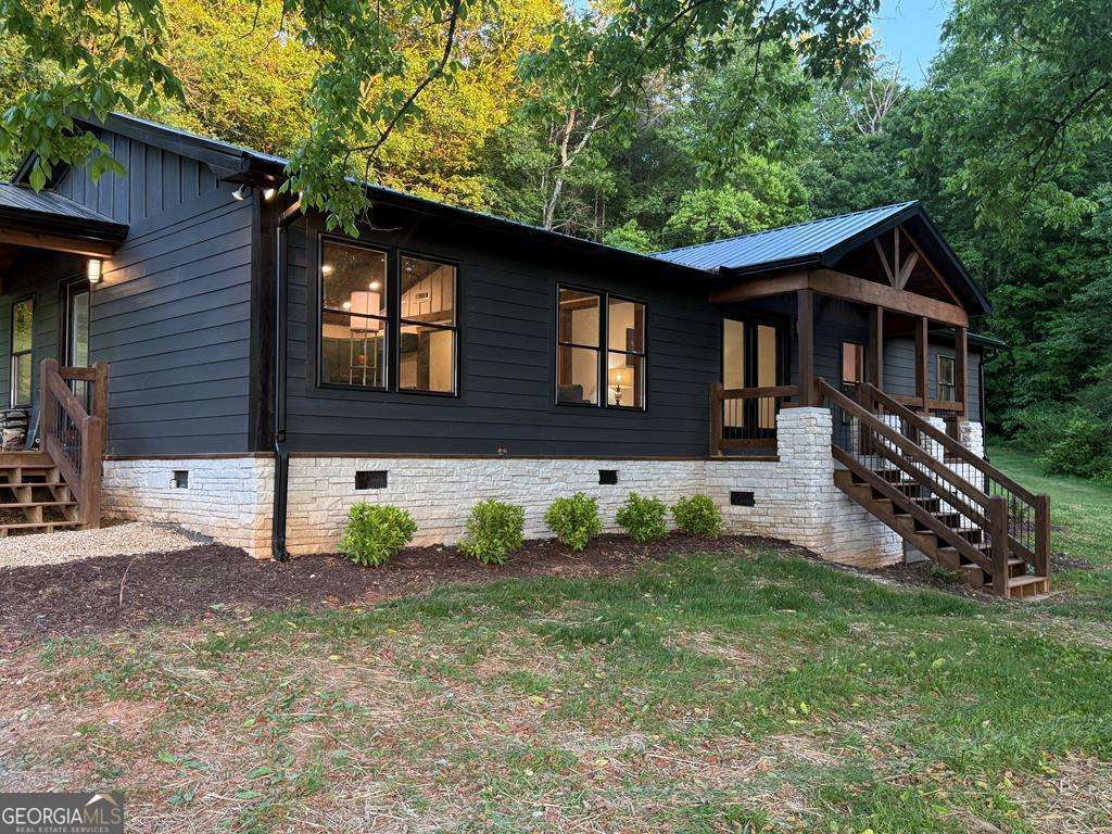 Newly renovated Farmhouse! 3 bedroom, 2 bath home in the Blue Ridge Mountains!! Situated on 2.75 unrestricted acres with outdoor space for garden, storage unit, kids and the dogs. The home boasts an open floor plan with high beamed ceilings and modern amenities throughout the Living Room, Dining Room and Kitchen. Primary bedroom en suite with cathedral ceilings and large closet, exquisite tiled shower in primary bathroom with 2 shower heads and double vanities. 2nd bedroom with high modern slanted ceilings and bay window . 3rd bedroom and a full 2nd bathroom with Shower/Tub combo. A great Laundry room with washer/dryer available, an additional private entry off the back BBQ deck. Furniture can be purchased on a separate Bill of Sale.