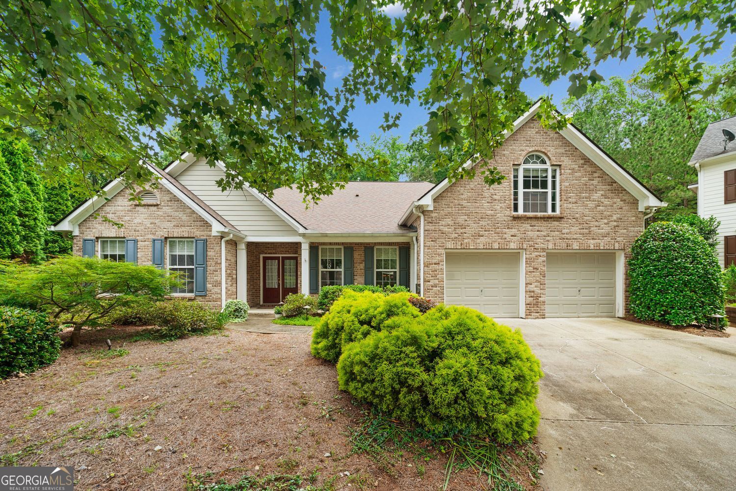 Welcome to this charming split-bedroom ranch plan in a prime location! This beautifully maintained home features soaring vaulted ceilings, a spacious formal dining room, and a family room perfect for your largest furniture pieces. The heart of the home-a pristine kitchen with a center island, separate gas cooktop, walk-in pantry, and new KitchenAid appliances-flows into a cheerful breakfast room with stunning views of the lushly landscaped, fenced backyard. Generously sized owner suite features dual walk-in closets. The owner's bath offers a walk-in shower, dual vanities, and a therapeutic walk-in tub designed with accessibility features. A dedicated office/library with custom built-ins offers the perfect work-from-home space, and the large bonus room above the garage provides flexibility as a 4th bedroom, hobby room, or guest retreat. Step outside to your own garden sanctuary-complete with an arbor-covered patio, steppingstones, landscape lighting, and charming birdhouses-all backing to a wooded area for exceptional privacy. Fantastic HOA amenities, include a heated pool, tennis and pickleball courts and playground. Located in a quiet cul-de-sac and just minutes from I-85, Hwy 316, Sugarloaf Parkway, shopping, and dining-this immaculate, move-in-ready home is the perfect blend of comfort and convenience!