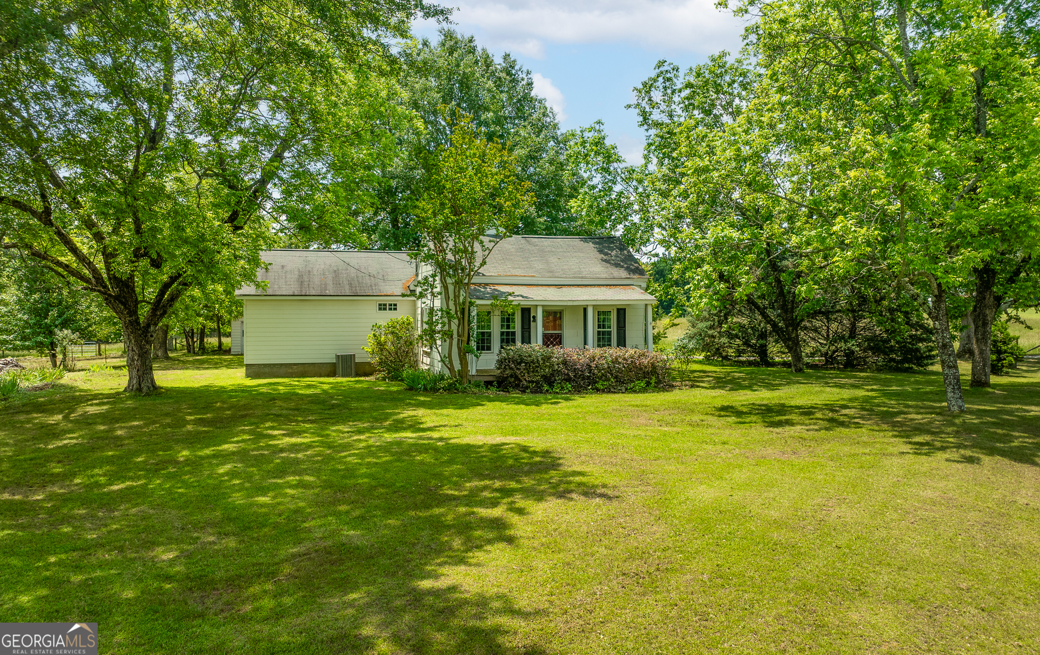 HVAC replaced 2022, New Water Heater, Septic replaced in 2016. Termite Service until Oct 1, 2025. Step into timeless charm and modern comfort with this beautifully renovated farmhouse nestled on 1.375 acres located in Loganville. This homes classic character has been retained by blending the updates with some of the original materials of the home. Enjoy the spacious layout that includes a mudroom and laundry room and a large back porch perfect for relaxing or entertaining. The updated kitchen and bathrooms provide modern conveniences while honoring the homes's original charm. Outside you will find a detached garage mature trees and plenty of room to garden, play or expand. Don't miss the chance to own this unique slice of Loganville-schedule your showing today!