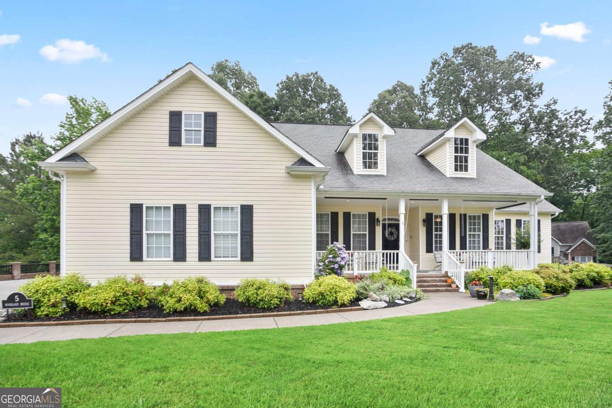 Elegant Southern Estate with Timeless Design in Adairsville! Welcome home, where Southern living meets modern sophistication. Set on a peaceful and private homesite, this exquisitely maintained 3-bedroom plus loft, 4 full bath, 2 half bath residence offers over 4,000 square feet of thoughtfully curated living space, blending comfort, craftsmanship, and character at every turn and truly feels like your own private bed-and-breakfast retreat. From the moment you arrive, the inviting warm curb appeal to the oversized front porch welcomes you with Southern hospitality and serene sense of peace. Inside, you're greeted by light-filled interiors, rich hardwood floors, and soaring ceilings that define the home's elegant, yet welcoming atmosphere. The open-concept main level is designed for both everyday living and entertaining, complete with a cozy fireplace in the living room and seamless access to a large screened-in back porch with a peaceful view of the tranquil surroundings. - perfect for relaxing or hosting guests. The gourmet kitchen offers generous counter space, custom cabinetry, and a layout that serves both function and style. The expansive Primary Suite is a true sanctuary, featuring dual walk-in closets, a spa-inspired ensuite bath, and private access to the tranquil back porch - the perfect place to begin or end your day. Guests and family alike will feel pampered, as each secondary bedroom offers its own beautifully appointed ensuite bath and walk-in closet, creating a private retreat for everyone. Upstairs, a versatile loft space with another full bath adds even more flexibility - ideal for a home office, cozy reading nook, or inspiring creative studio. Journey downstairs to discover over 1,000 sqft of additional finished living space on the terrace level - complete with a spacious bonus room and a cozy fireplace, perfect for a media lounge, guest suite, or game room. Adjacent is an expansive workshop offers endless possibilities, with plenty of room for tools, toys, creative hobbies, or weekend DIY projects. Whether you're building, storing, or creating, this space is designed to flex with your lifestyle. With a 3-car garage on the main level and an additional driveway to the terrace level, the home offers exceptional flexibility - perfect for multigenerational living, private guest quarters, or additional storage and parking. Located just minutes from I-75, this home is ideally situated between Atlanta and Chattanooga, quick access to shopping and dining providing a perfect balance of accessibility and serenity. If you're looking for space, comfort, character, and pride of ownership, this Adairsville gem checks every box - come experience its charm for yourself!