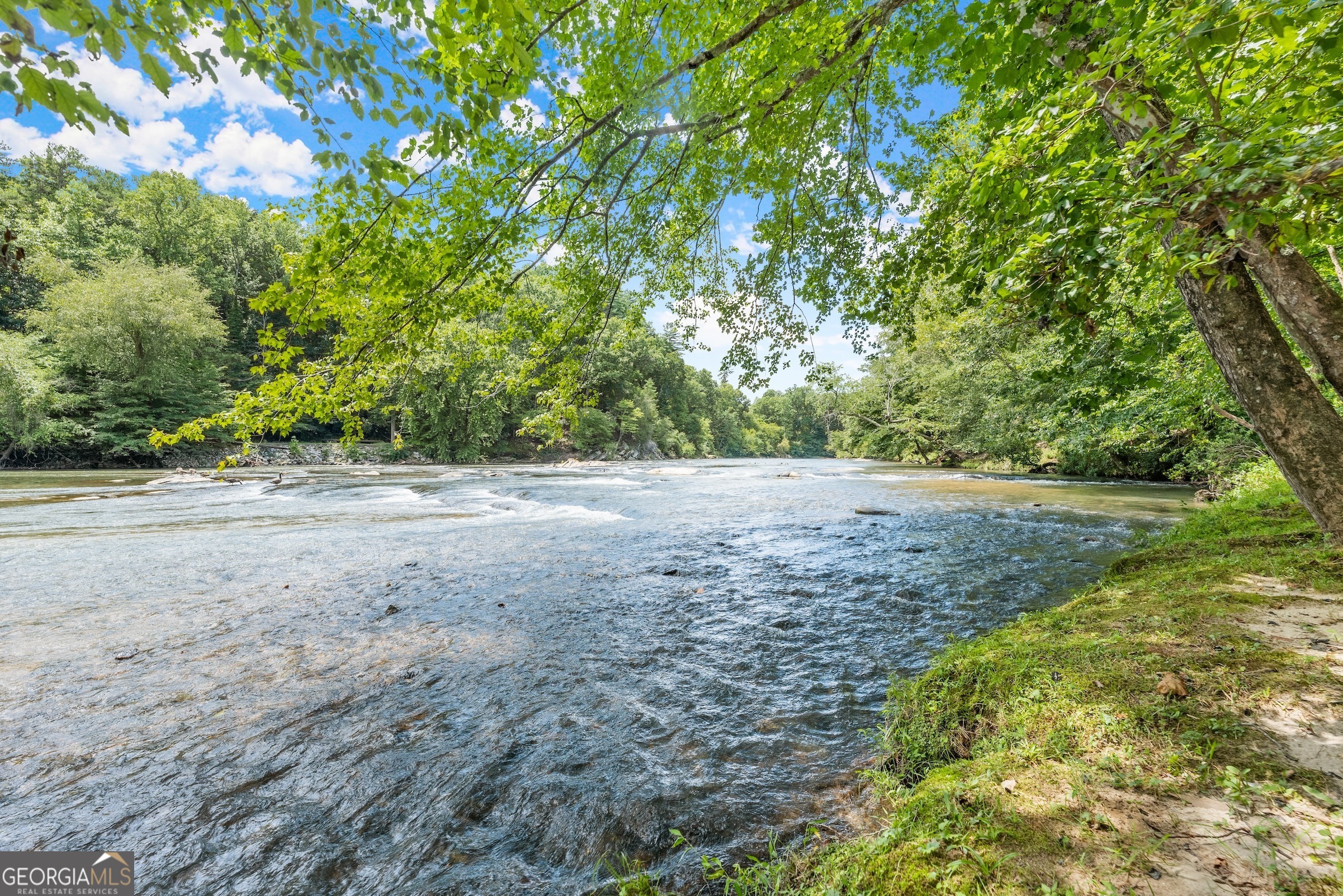 Discover the unparalleled beauty and tranquility of riverfront living with this exceptional vacant lot, nestled within the prestigious gated community of The River. This prime piece of real estate offers a unique opportunity to build your dream home on 1.78 acres of pristine land, boasting breathtaking water views, direct river access, and the security and exclusivity of a private gated community. All residents are granted community river access, as shown in some of the photos.