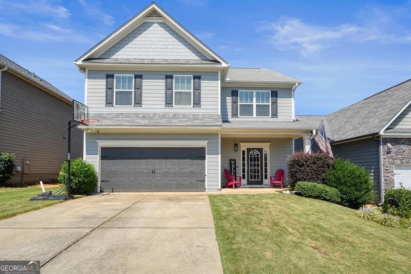 Welcome to your new home! This inviting 4-bedroom, 2.5-bath beauty is tucked inside a friendly swim community with a park, making it a wonderful place to gather with neighbors and enjoy the outdoors. Step inside and fall in love with the spacious, open kitchen that flows seamlessly into the living room. Perfect for entertaining or keeping everyone connected. The kitchen features granite countertops, a large island with bar seating, and a pantry for extra storage. Whether you prefer casual meals in the eat-in kitchen or hosting special dinners in the separate dining room, this home offers flexibility for every lifestyle. Upstairs, you'll find a generous second-story layout with a versatile bonus area. Ideal for a play space, home office, or media room. The family room is perfect for cozy nights in or gathering with friends and loved ones. You'll love the large, flat-fenced backyard. It is perfect for entertaining! Inside, the home offers a bright, comfortable layout with plenty of natural light, creating a warm and welcoming space for everyday living. Located just minutes from downtown Canton and Ball Ground, you'll have quick access to charming shops, restaurants, and local events. Plus, this home is in an area known for its highly rated schools, giving you extra peace of mind. This home has the perfect mix of community amenities, space, and convenience. All that's missing is you!
