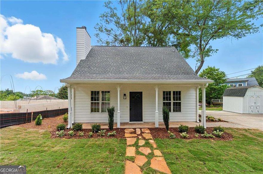 Discover this beautifully renovated two-story home just steps from the vibrant Marietta Square! Located in the heart of the City of Marietta, you'll enjoy easy access to charming shops, dining, parks, and top-rated schools. This 2-bedroom, 2-bath home combines modern updates with cozy character, featuring a warm fireplace and an open, functional layout perfect for both everyday living and entertaining. Situated on a spacious corner lot, the property offers excellent curb appeal, extra privacy, and plenty of outdoor space. Inside, you'll find a brand-new kitchen with stainless steel appliances, sleek cabinetry, and updated countertops. Additional upgrades include fresh paint, new flooring, stylish light fixtures, new interior & exterior doors, and completely renovated bathrooms. Additionally home comes with a new alarm alarm system. Move-in ready and full of charm-this is one you don't want to miss! Call about incentives.