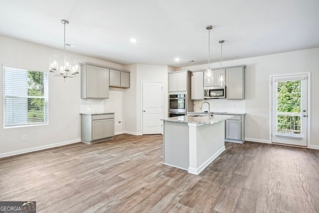 Photo of 412 River Walk Farms Pkwy #LOT 44, Covington, GA 30014 (MLS # 10689080)