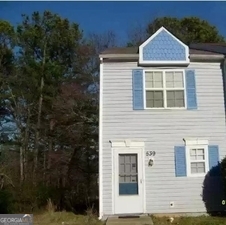 Attention all Investors!!! Home SOLD AS-IS. Immediate Rental income of $1700 plus per month. 2 bed, 2 bath newly renovated unit of 1100 square feet. Has been tenant occupied until recently with consistent payments. No HOA fees. Hurry, this will go fast!!! Luxury end-unit Townhouse in Prince of Wales Community with security Alarm. Ideal roommate floor plan with 2 baths, 2 large bedrooms with cathedral ceilings. Master and second bedroom suite each with private bath. New wood flooring throughout the unit. Kitchen with breakfast bar, all appliances remain, pantry, dishwasher, and dining area. Extra large living room with stone fireplace, with back door leading to a private fenced in patio, with an attached storage Room. Laundry closet with washer/dryer hookup to accommodate a full size washer and dryer. End lot with front, side and backyard. On Marta bus line. Unit is occupied with furniture. The property is available for showings by appointment only. No creative financing and only serious inquiries please!