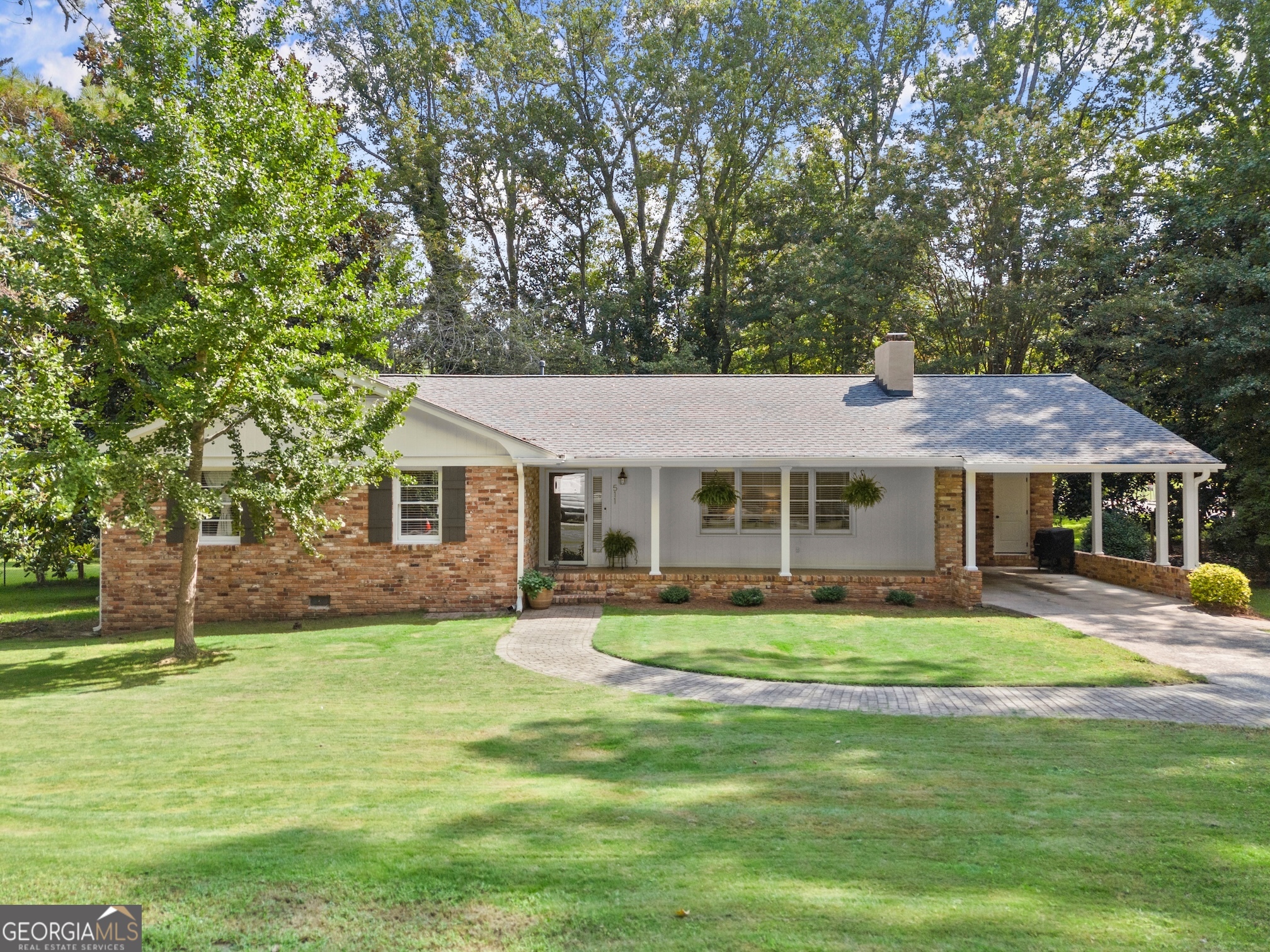 This beautifully updated 3-bedroom, 2-bath ranch blends classic 1960s charm with modern style and comfort. Nestled on a spacious corner lot in North Winder, this home offers an inviting family room with a cozy fireplace, a master suite on the main level, and an updated kitchen featuring stainless steel appliances and stylish finishes. The home boasts large secondary bedrooms, providing plenty of space for family, guests, or a home office. Enjoy relaxing on the covered front porch or entertaining in the level, shaded yard-perfect for gatherings and outdoor activities. With tasteful modern touches throughout, this home offers the perfect balance of character and functionality. Located close to schools, downtown Winder, shopping, and dining, this home combines convenience, comfort, and timeless appeal.
