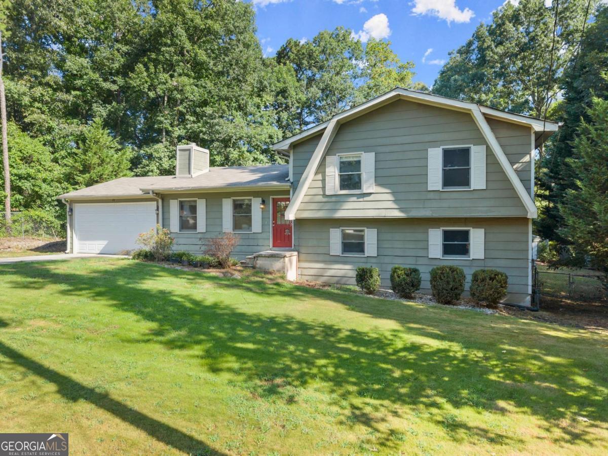 Welcome to 6345 Iris Drive-a move-in-ready home tucked in a quiet cul-de-sac in one of Flowery Branch's most desirable areas, with no HOA and easy access to Spout Springs Road and I-985. Inside, you'll love the split floor plan with tons of space, featuring 3 bedrooms upstairs and an optional 4th bedroom or bonus room in the finished basement. The heart of the home is the large open-concept kitchen and dining area, perfect for everyday living and entertaining. A cozy fireplace adds warmth to the living space, and fresh paint throughout gives it a clean, updated feel. Step outside to enjoy the newer above-ground pool and deck, perfect for summer fun, and a large, private backyard with room to play, garden, or relax in peace. Located in the highly rated Cherokee Bluff school district, this home offers great value and space in a fast-growing area. Priced to sell quickly-don't miss your chance to call this one home!