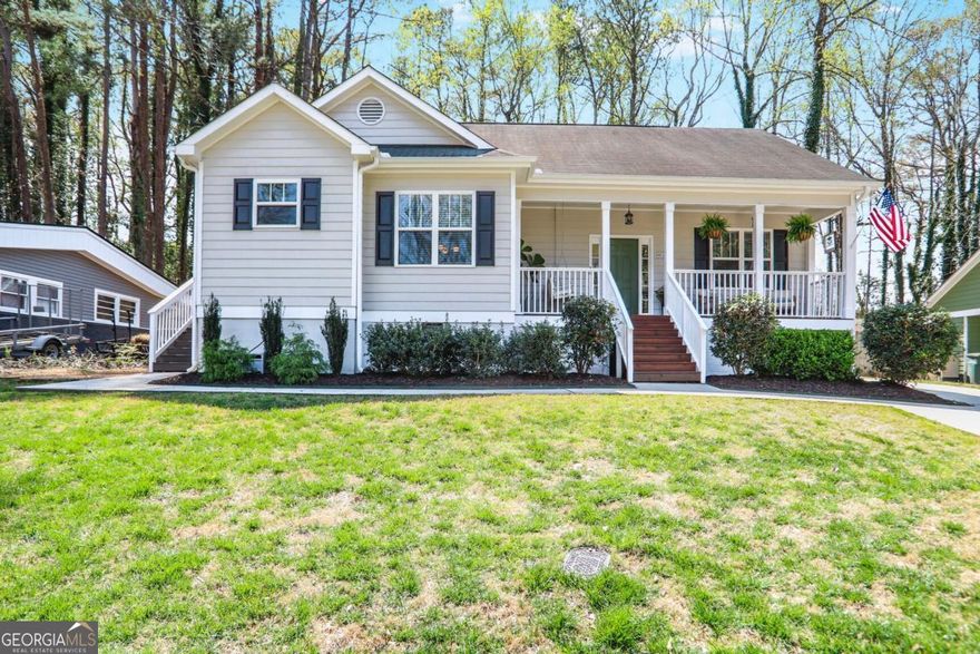 A rare find in Historic City of Marietta, this modernized 2008 charming bungalow with many unique gems including a deep lot that backs to the City Golf Club of Marietta and special  detached studio/office. A welcoming front porch greets all that enter this delightful home with high ceilings and natural light filled rooms.  The kitchen is especially bright with quartz countertops, white cabinetry, stainless steel  appliances, island/breakfast bar, pantry, desk, large dining area and grilling porch.. The living room has spacious comfort and a view to the kitchen.  Experience a seren roomy primary bedroom with a custom walk-in closet and private bath. Secondary bedrooms are spacious with good size closets and a lovely full bath. Laundry is conveniently located near all the bedrooms. Other extras inside are: double pane windows, newer deep kitchen sink, updated decorative lighting, recessed lighting and fans. Outside extras are the detached studio currently being used as an office/man cave/flex space, the studio has recessed lighting and upgraded electrical for future mini split HVAC, newer driveway with double parking for the house and extended drive for the studio, relaxing entertainment space in the backyard with pea gravel and raised beds. Strolling distance to the square with amazing restaurants, breweries, shopping, museums, local events, Saturday morning market, summer concerts and exceptional parks.  Convenient to interstates and Peach Pass entrance/exit.  A couple blocks from Kennesaw Mountain to Chattahoochee River Trail and close to Kennesaw Mountain National Battlefield Park with miles of outstanding hiking trails. Come enjoy this live work play lifestyle.