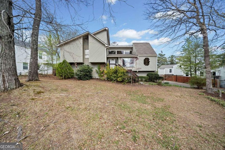 East Cobb Charm Meets Modern Comfort - No HOA! Nestled in a prime East Cobb location, just minutes from Historic Roswell, this beautifully updated home shines in the desirable Pope High School district. As you enter, the vaulted fireside great room greets you with an abundance of natural light from skylights and floor-to-ceiling windows, creating a warm and inviting ambiance. The kitchen, equipped with granite countertops and stainless steel appliances, seamlessly connects to the separate dining room, perfect for family gatherings and dinner parties. With five spacious bedrooms and three full baths, this home offers ample room for everyone. The finished basement provides two additional bedrooms, a recreation room, and plenty of possibilities for an in-law or teen suite. Recent updates offer peace of mind. The new HVAC system is from 2022. The water heater is from 2023, and the roof was done in 2020. Plus, the termite retreat and repair bond provide extra protection. The private, fenced backyard is a tranquil oasis with lush perennials and ample space to relax or entertain. A two-car garage and additional guest parking add to the home's convenience, and with no HOA restrictions, you're free to make it your own. Don't miss this opportunity to call this beautifully updated East Cobb home yours!